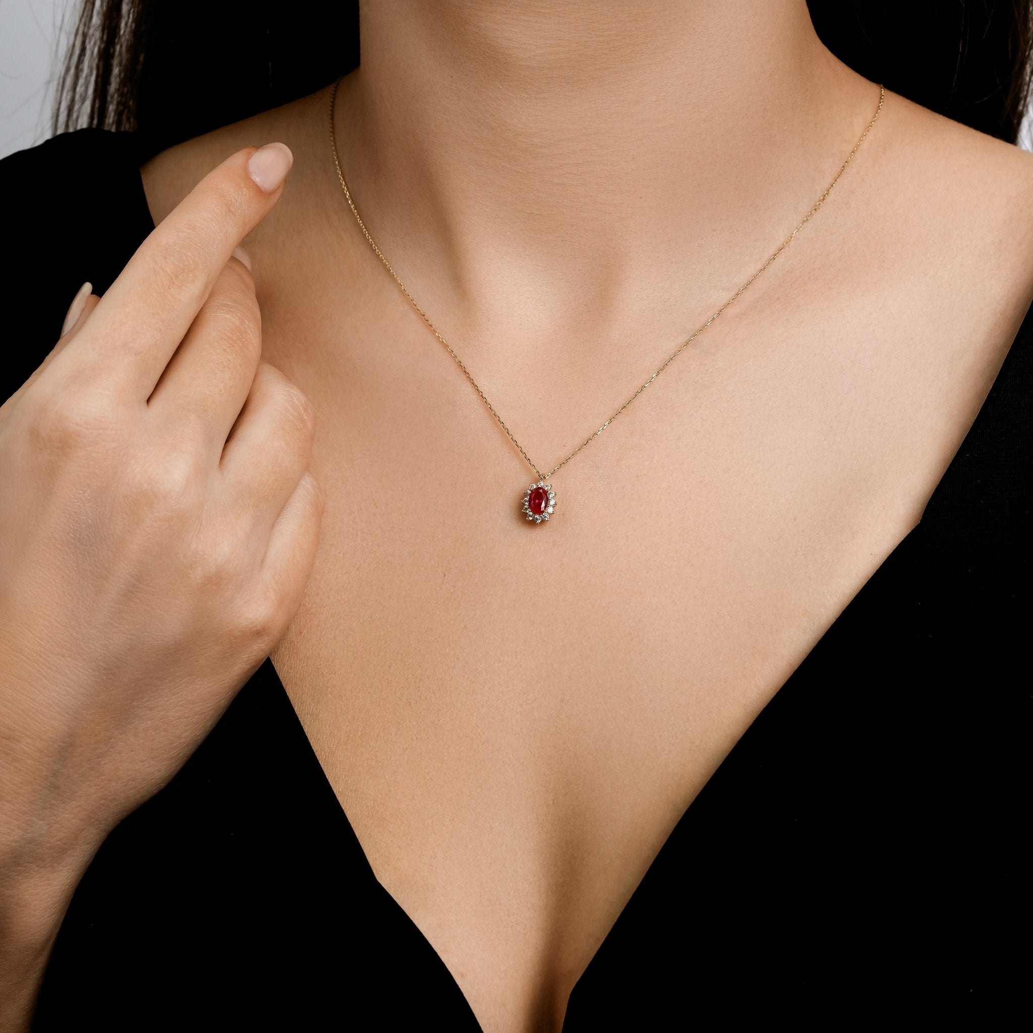Dainty 14K solid yellow gold necklace featuring a lab-created oval ruby pendant with cz stones.