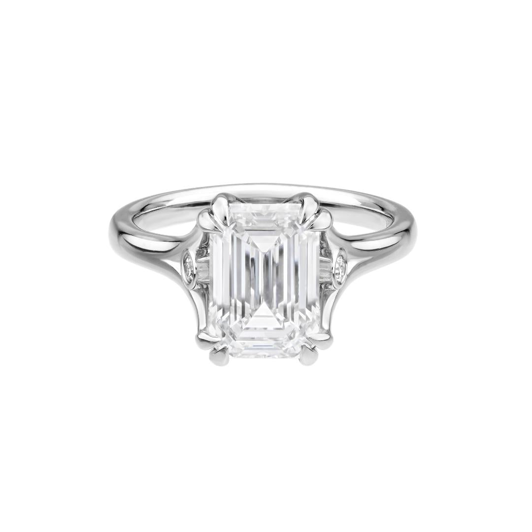 14K white gold emerald cut diamond engagement ring with 3ct lab grown diamond center and side diamonds, shiny finish.