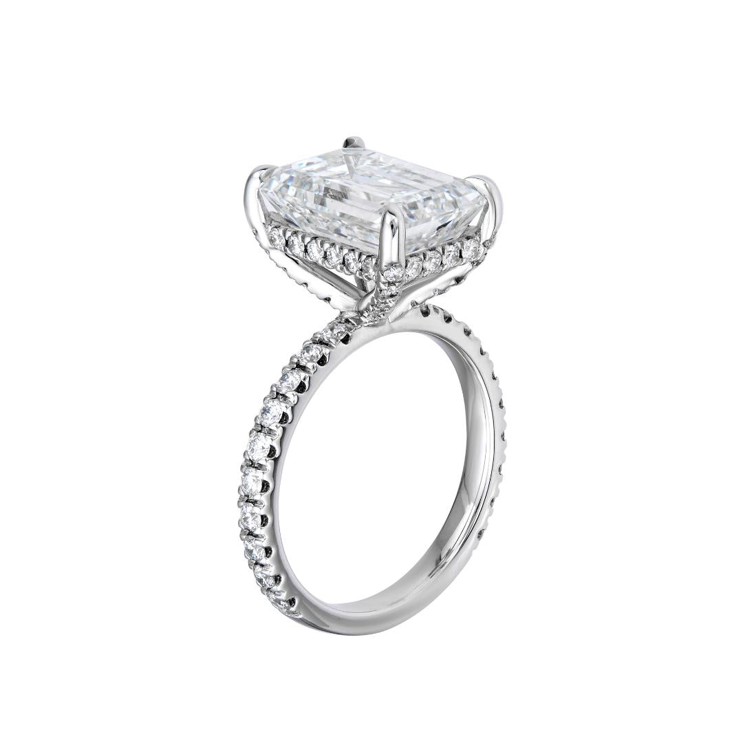 14K white gold emerald cut lab diamond engagement ring with side stones and shiny finish.