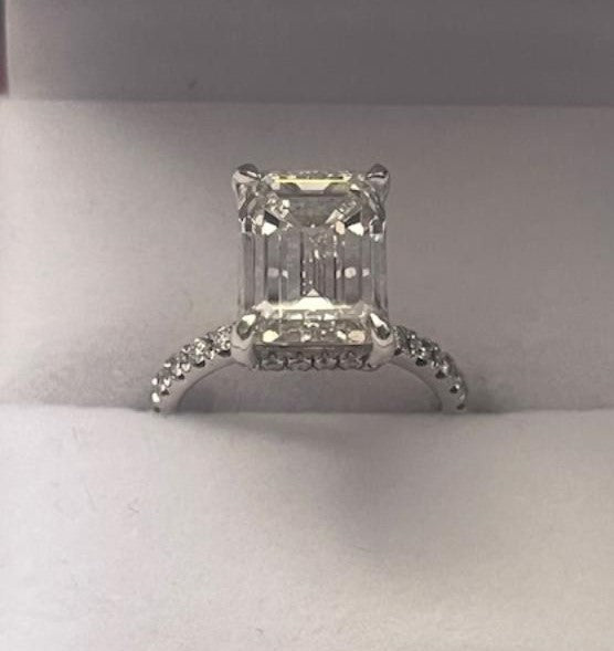 14K white gold emerald cut lab diamond engagement ring with side diamonds, shiny finish and IGI certified.