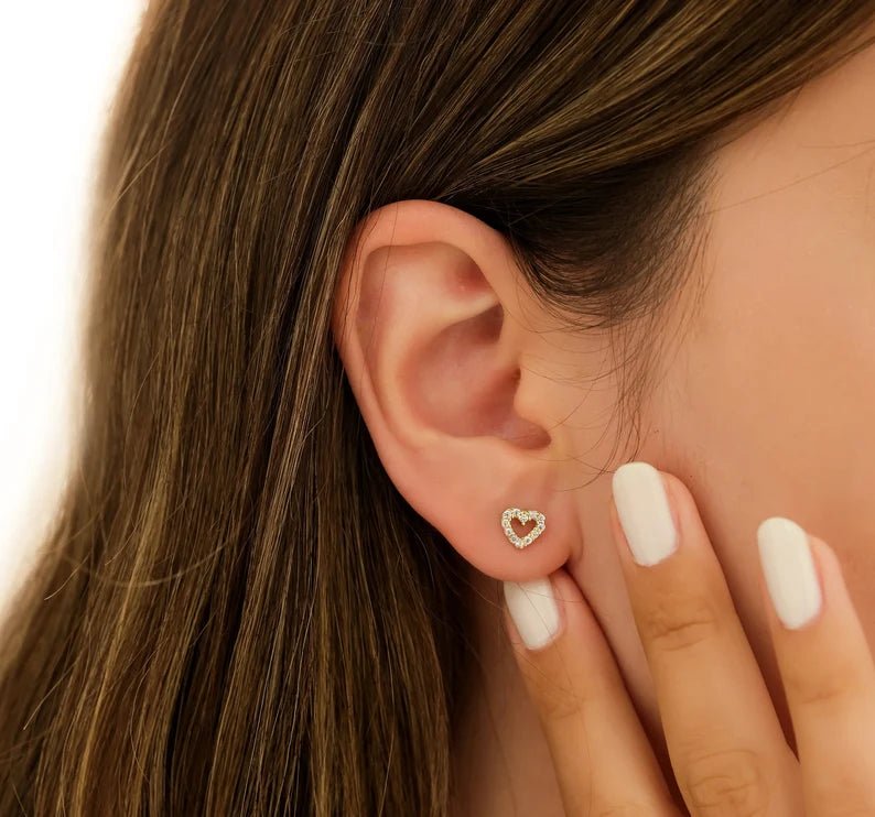 14K yellow gold minimalist heart stud earrings with CZ; perfect for everyday wear.