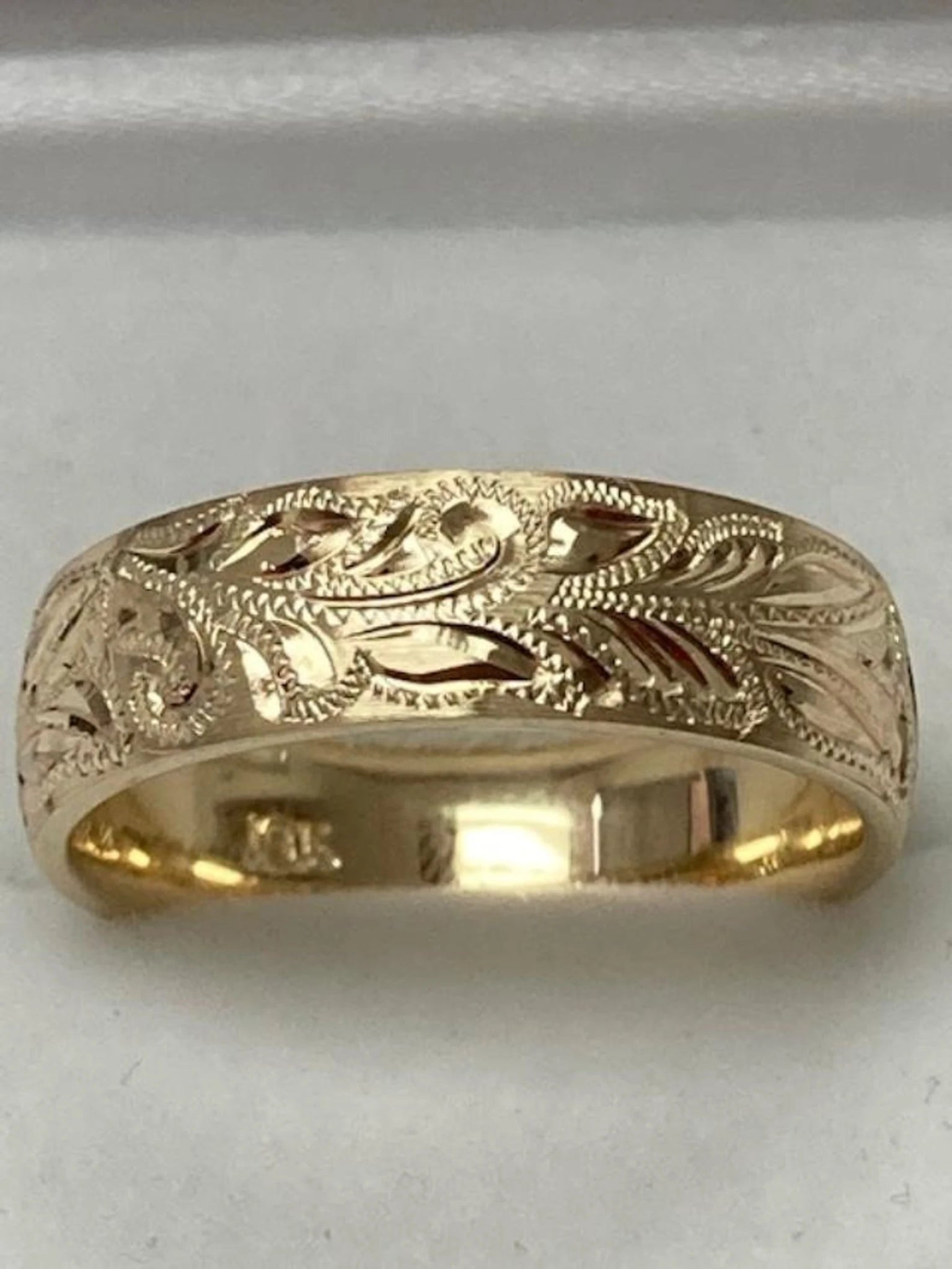Hand engraved 10K 14K 18K solid yellow gold men's wedding band with shiny leaf motifs, 6mm wide, comfort fit, made in New York.