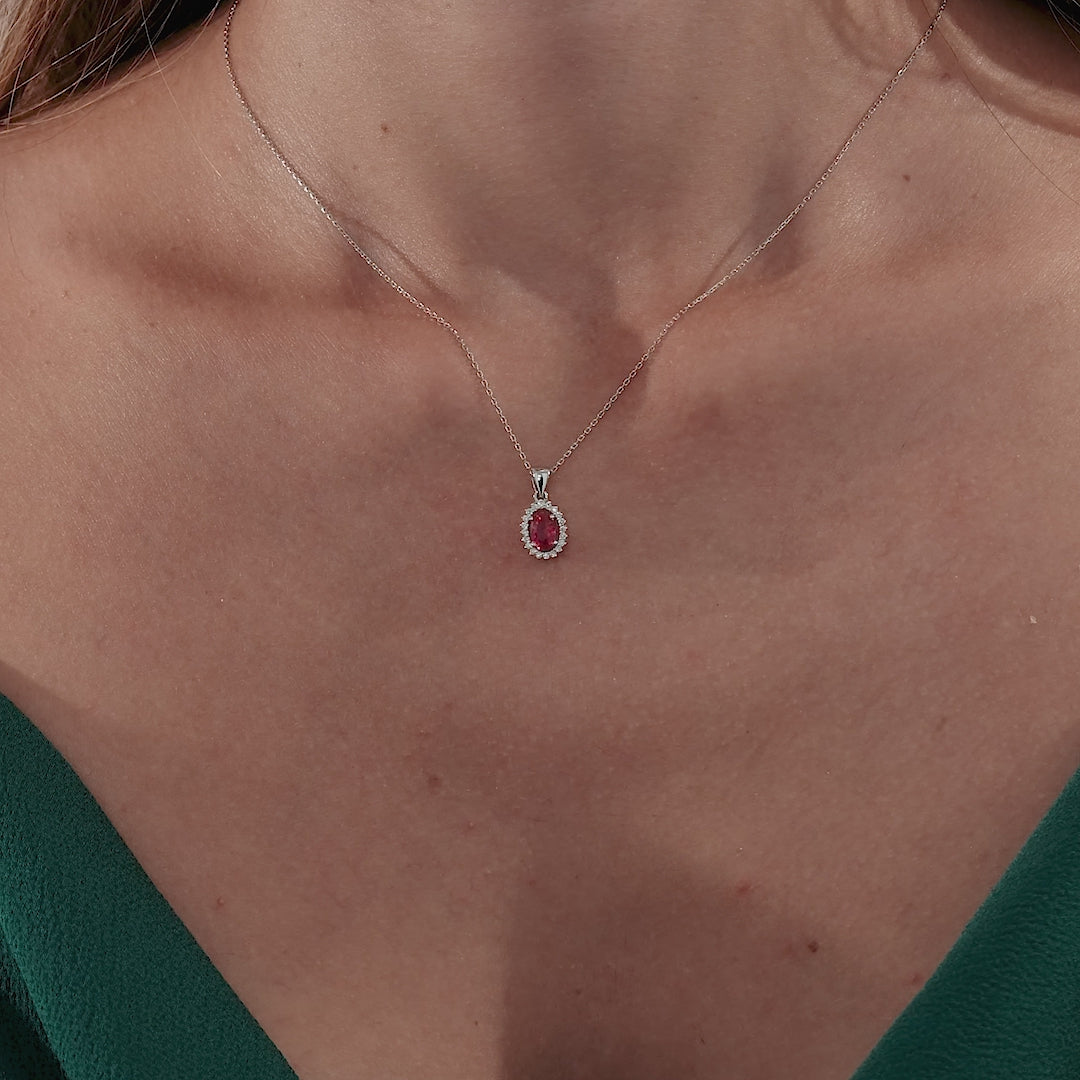 14K yellow gold pendant necklace featuring a lab-created ruby surrounded by natural diamonds, elegant and dainty.