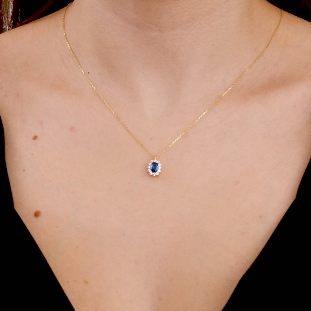14K solid yellow gold necklace featuring an oval sapphire pendant, ideal for casual or elegant outfits.