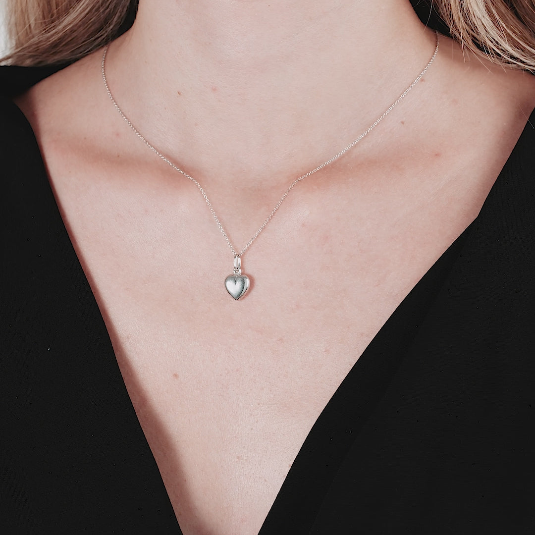 Dainty 14K White Gold shiny puffed heart necklace worn on a model, showcasing elegant simplicity and everyday wear.