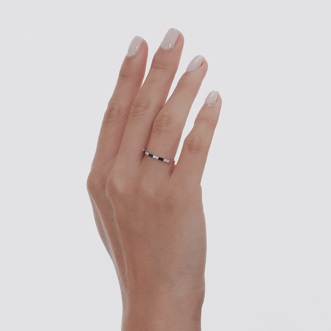 14K solid white gold wedding ring featuring sapphires and diamonds, worn on a model's hand.
