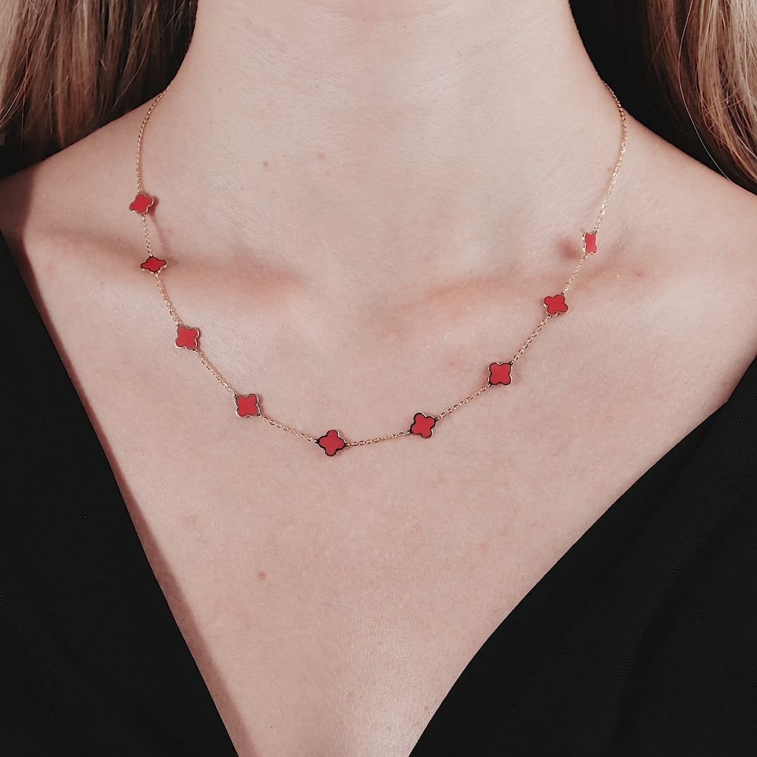 14K yellow gold necklace featuring red coral four leaf clovers in a stylish station design, elegant and perfect for gifts.