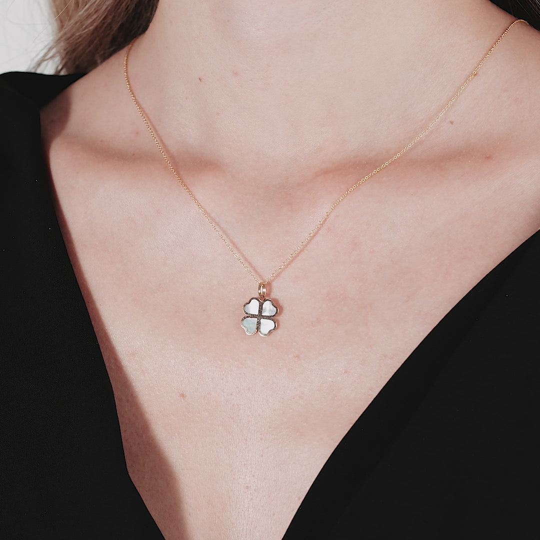 Dainty 14K yellow gold necklace featuring a natural mother of pearl four leaf clover pendant, perfect for everyday wear.