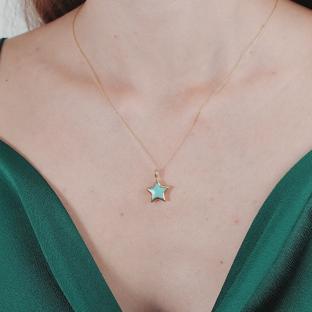 14K yellow gold turquoise puffed star necklace worn on a model, elegant and perfect for everyday use.