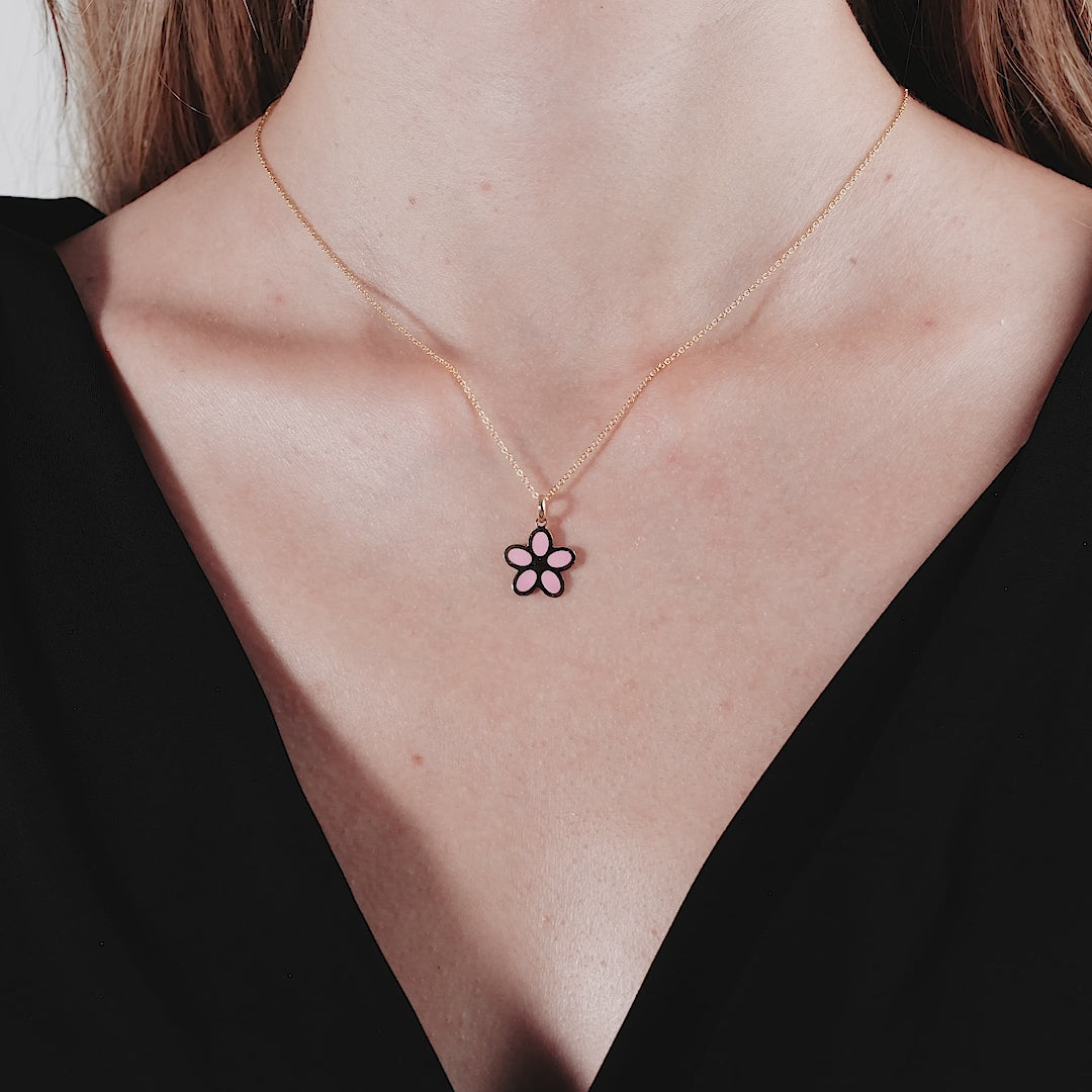 14K yellow gold dainty pink daisy flower necklace worn by a model, perfect for everyday elegance.