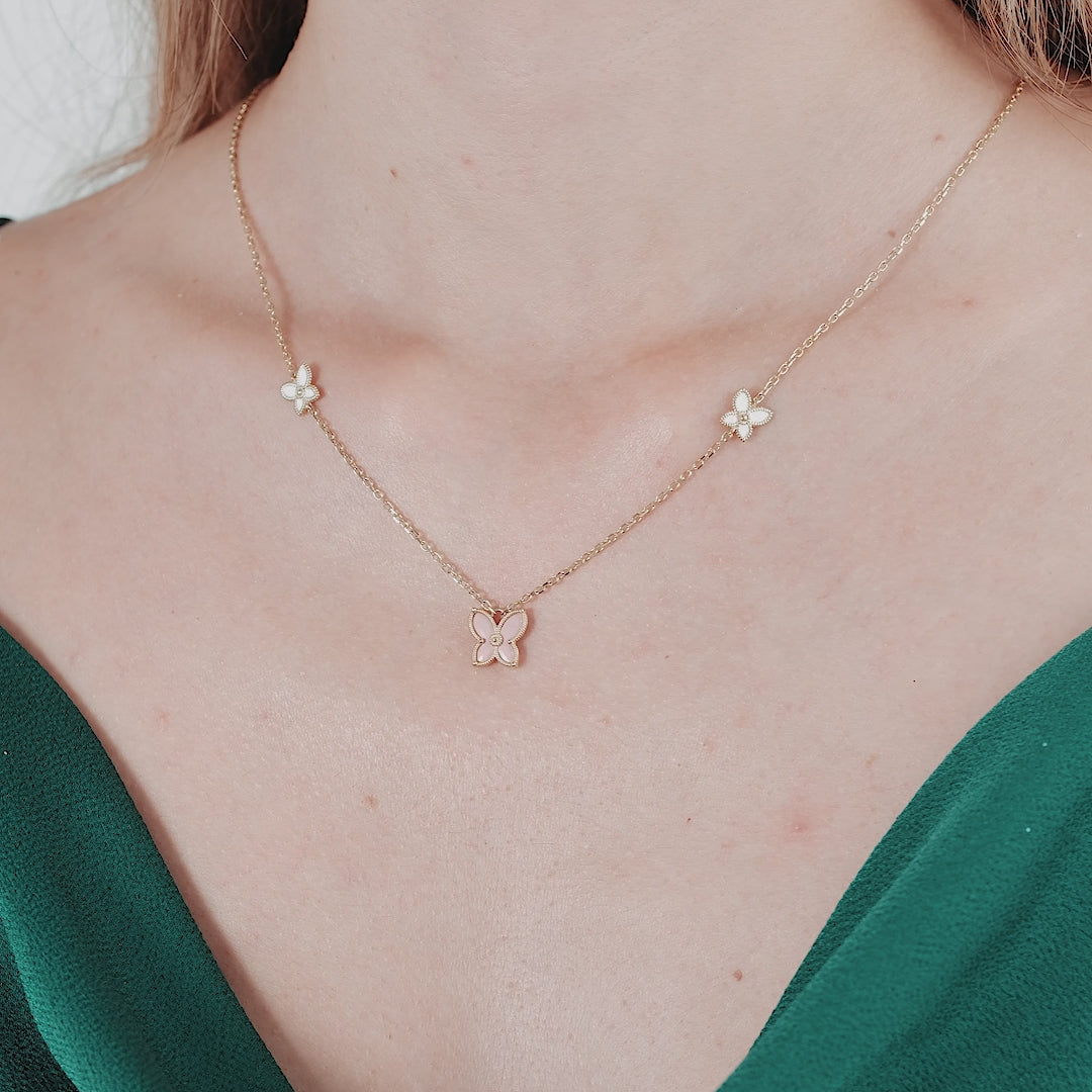 Delicate 14K solid yellow gold butterfly necklace featuring mother of pearl details, perfect for everyday wear.