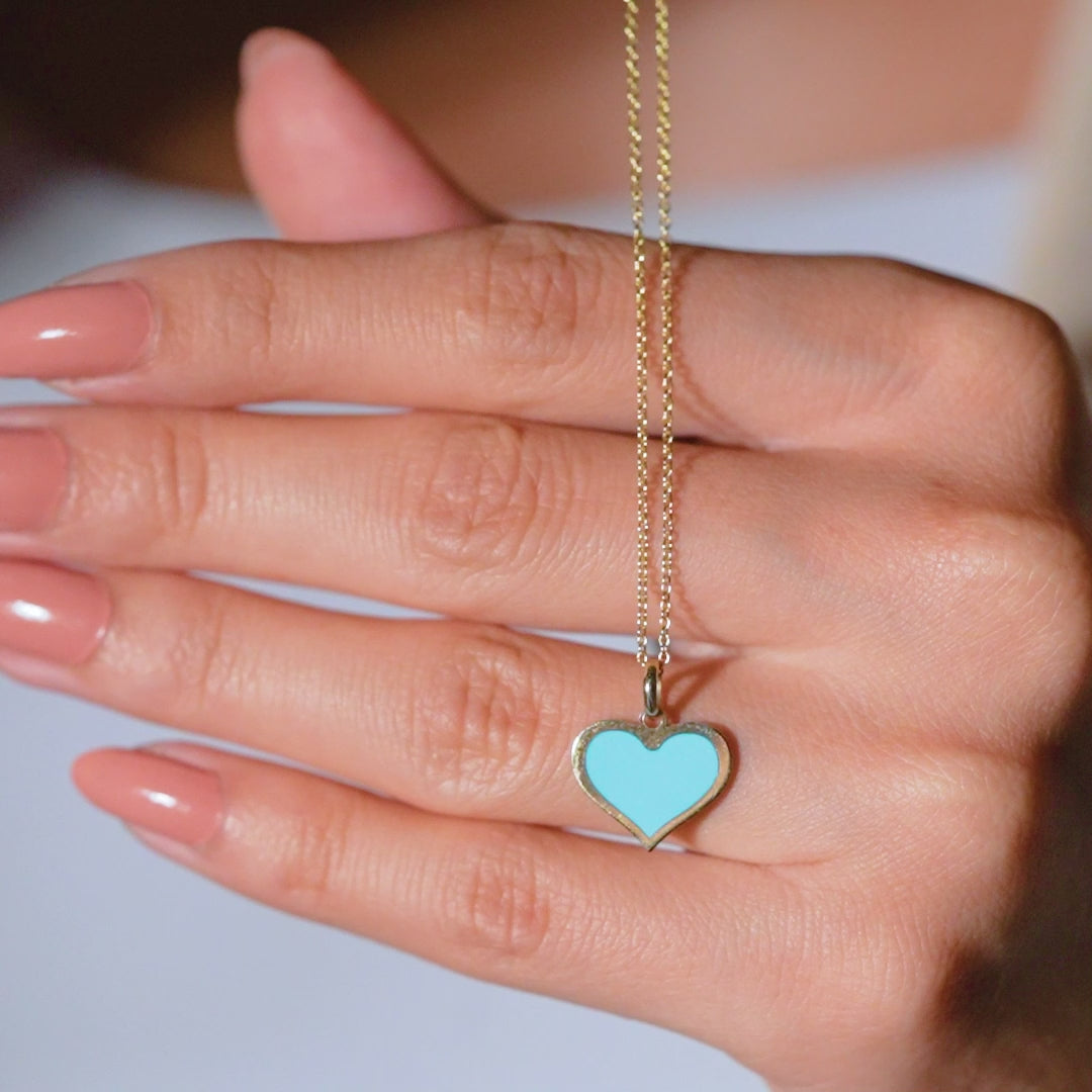 14K yellow gold necklace with turquoise heart pendant showcased on a hand, perfect for everyday wear.