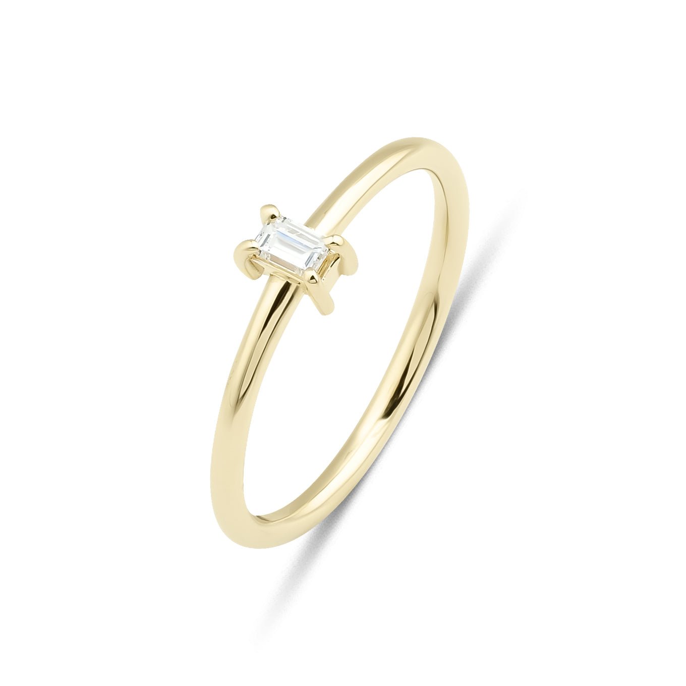 14K gold baguette diamond solitaire ring with a simple, elegant design and sparkling 0.10 carat diamond.