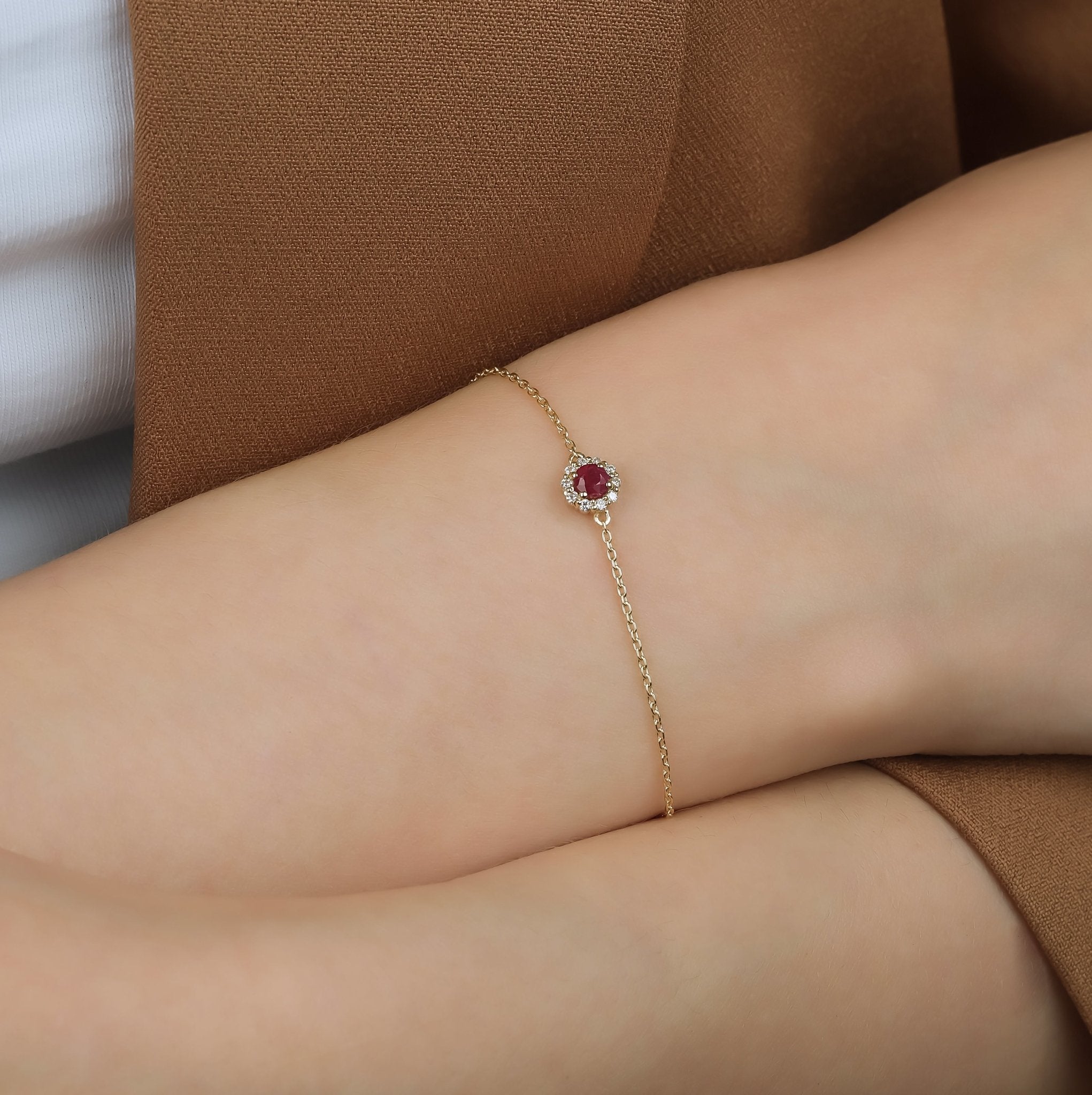 14K gold bracelet featuring a natural ruby and diamond centerpiece, worn on a wrist, perfect for everyday elegance.