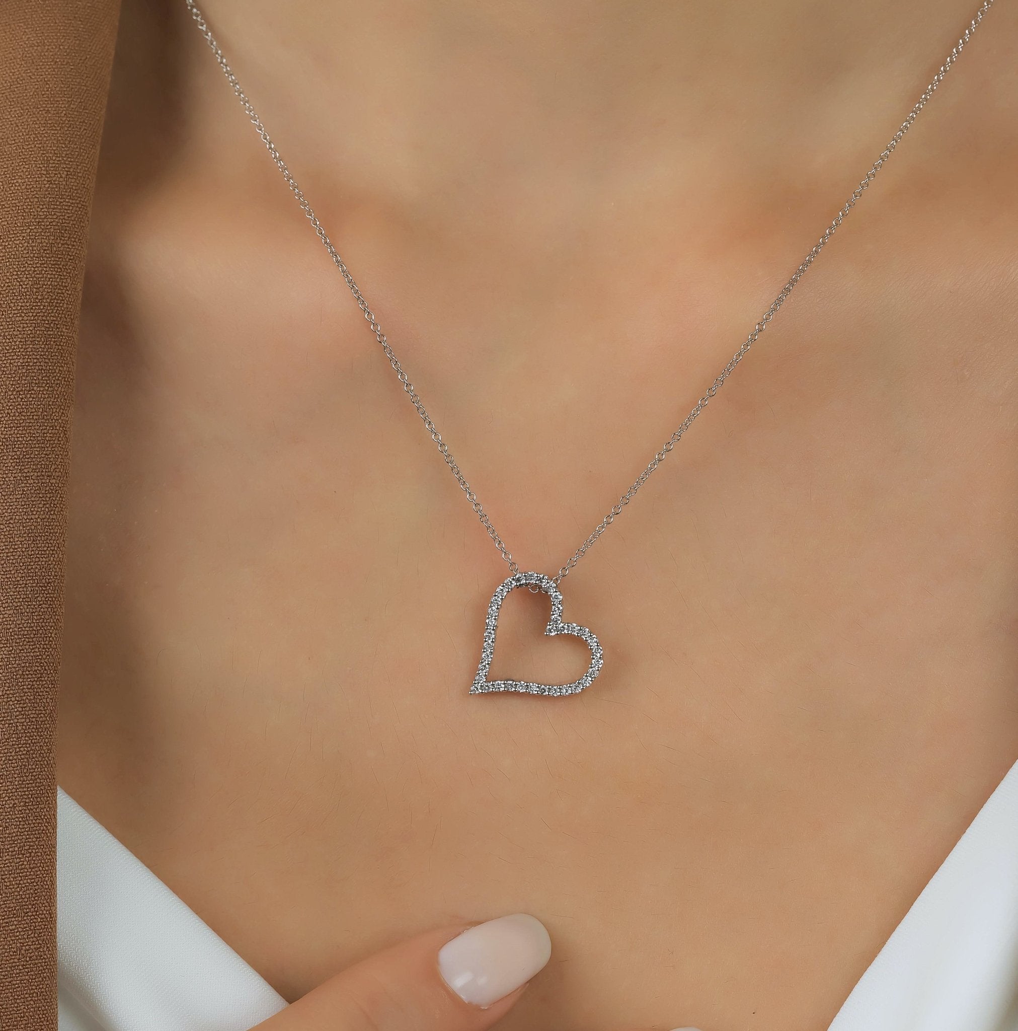 14K white gold heart necklace with diamonds, featuring a delicate design and elegant sparkle.