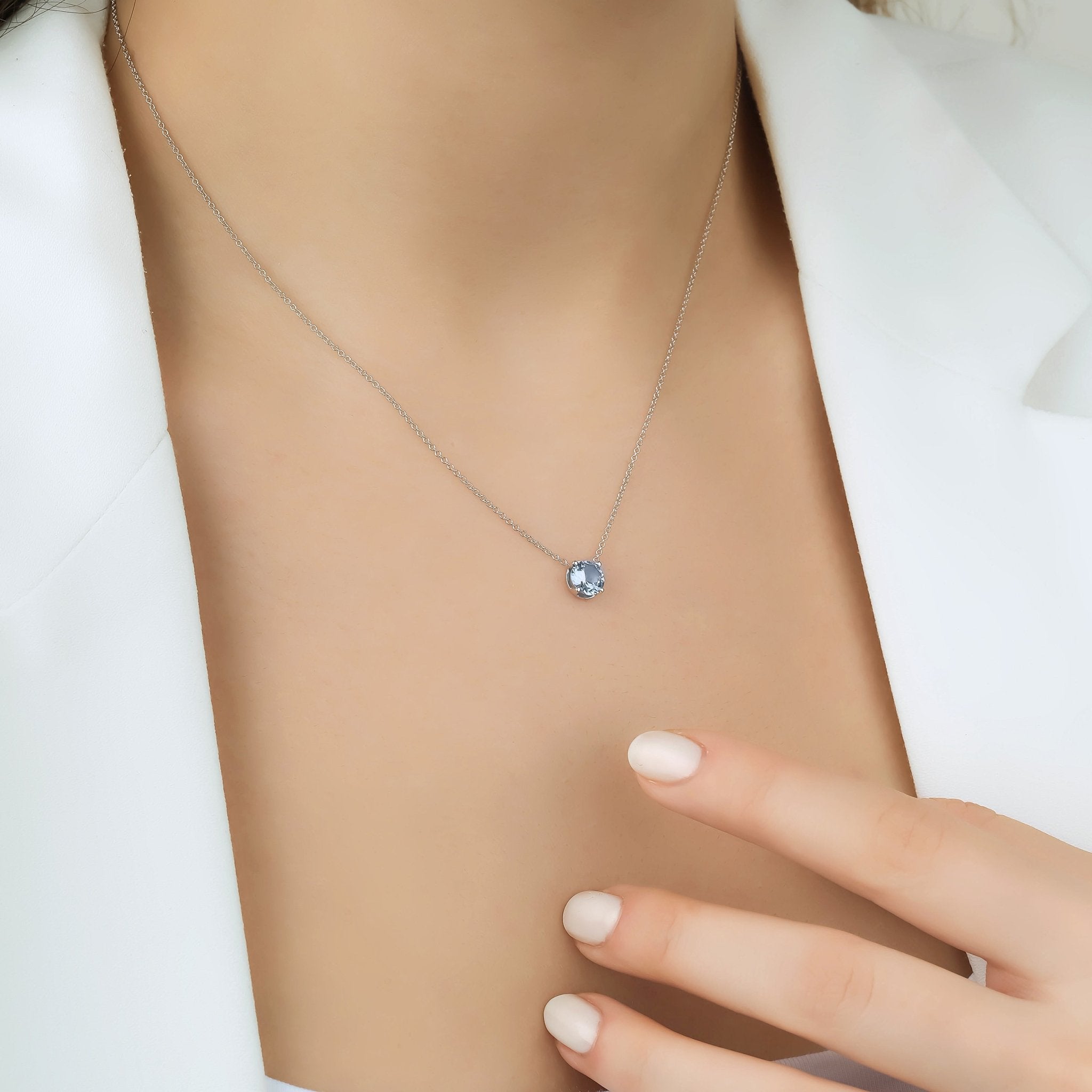 14K white gold 6mm prong setting aquamarine solitaire necklace on model, elegant minimalist design, perfect for everyday wear.