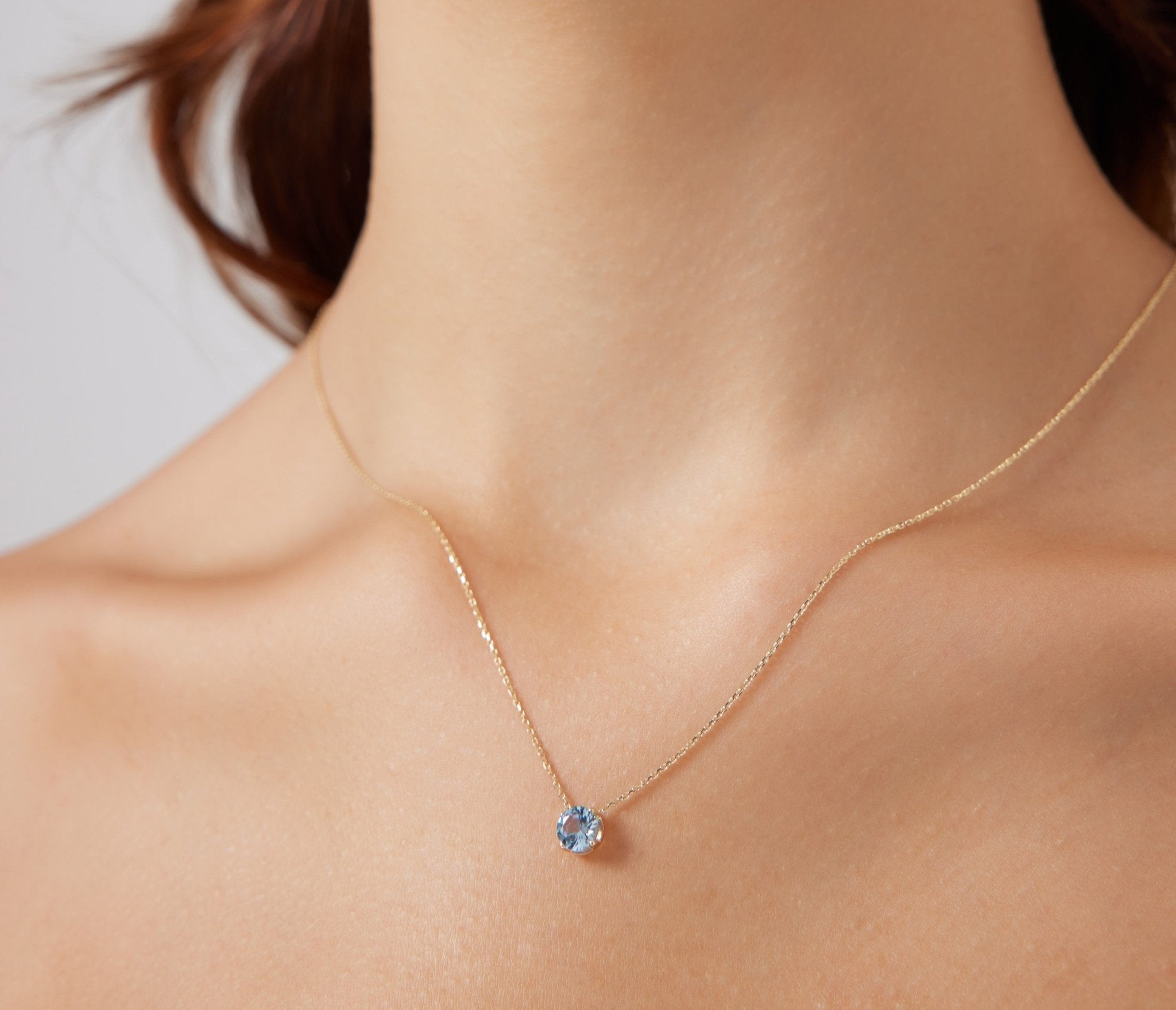 14K white gold necklace with 6mm lab-created aquamarine gemstone, perfect for everyday wear.