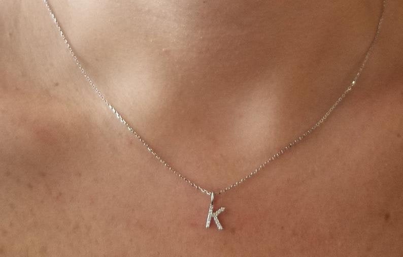 14K white gold diamond initial necklace with letter K, featuring sparkling diamonds on dainty chain.