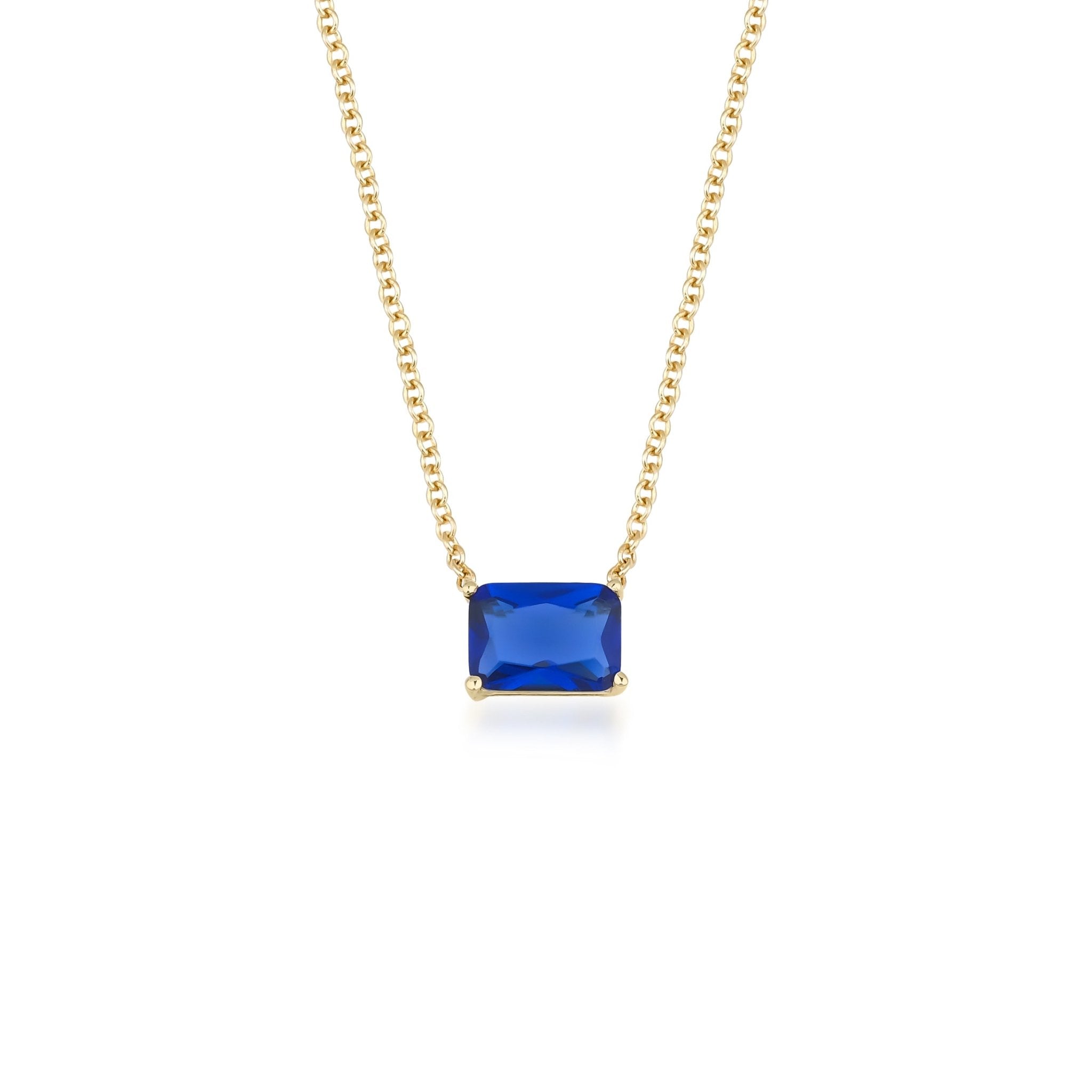 14K white gold emerald cut sapphire solitaire necklace, featuring a vibrant blue sapphire pendant in a minimalist design.