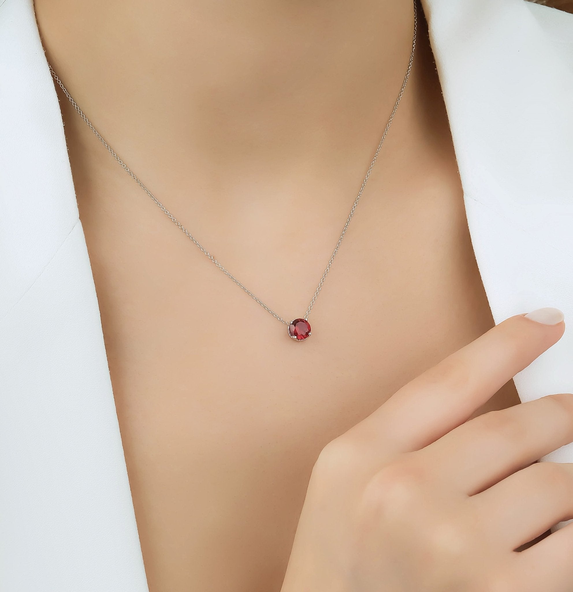 14K white gold 6mm prong setting solitaire ruby necklace worn by a model, showcasing minimalistic elegance.