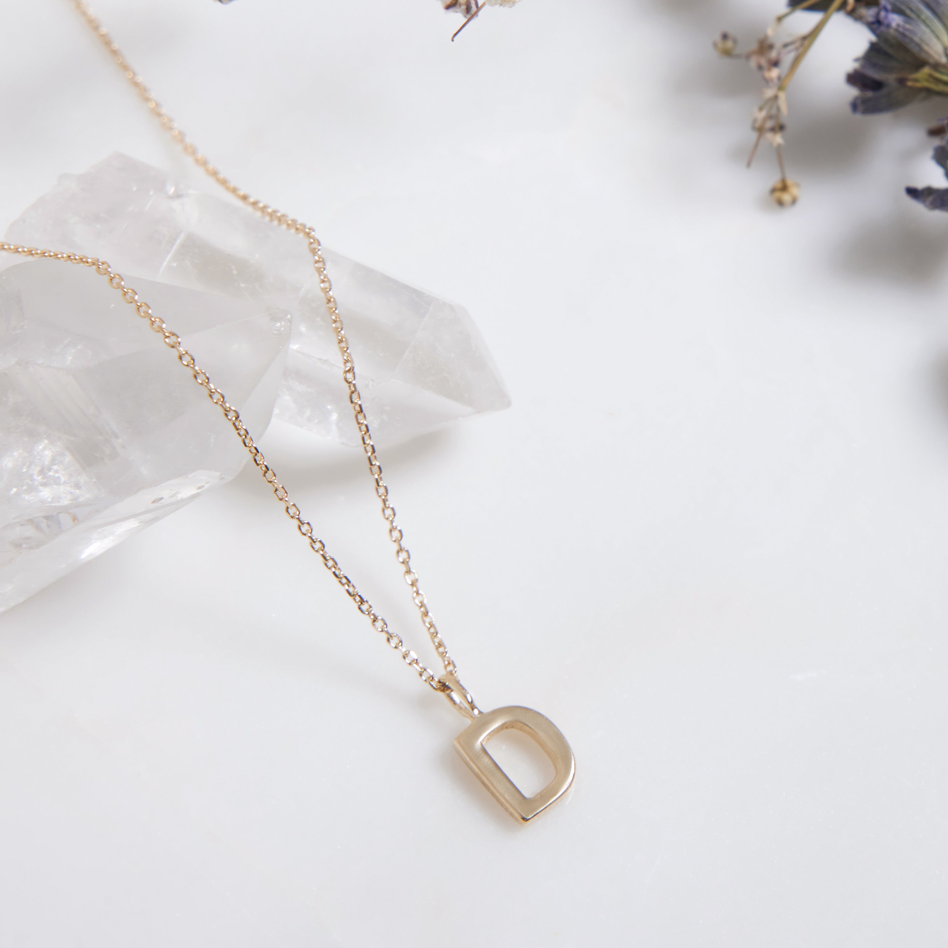 14K solid yellow gold initial necklace featuring a dainty letter D design, elegant and simple, perfect for layering.