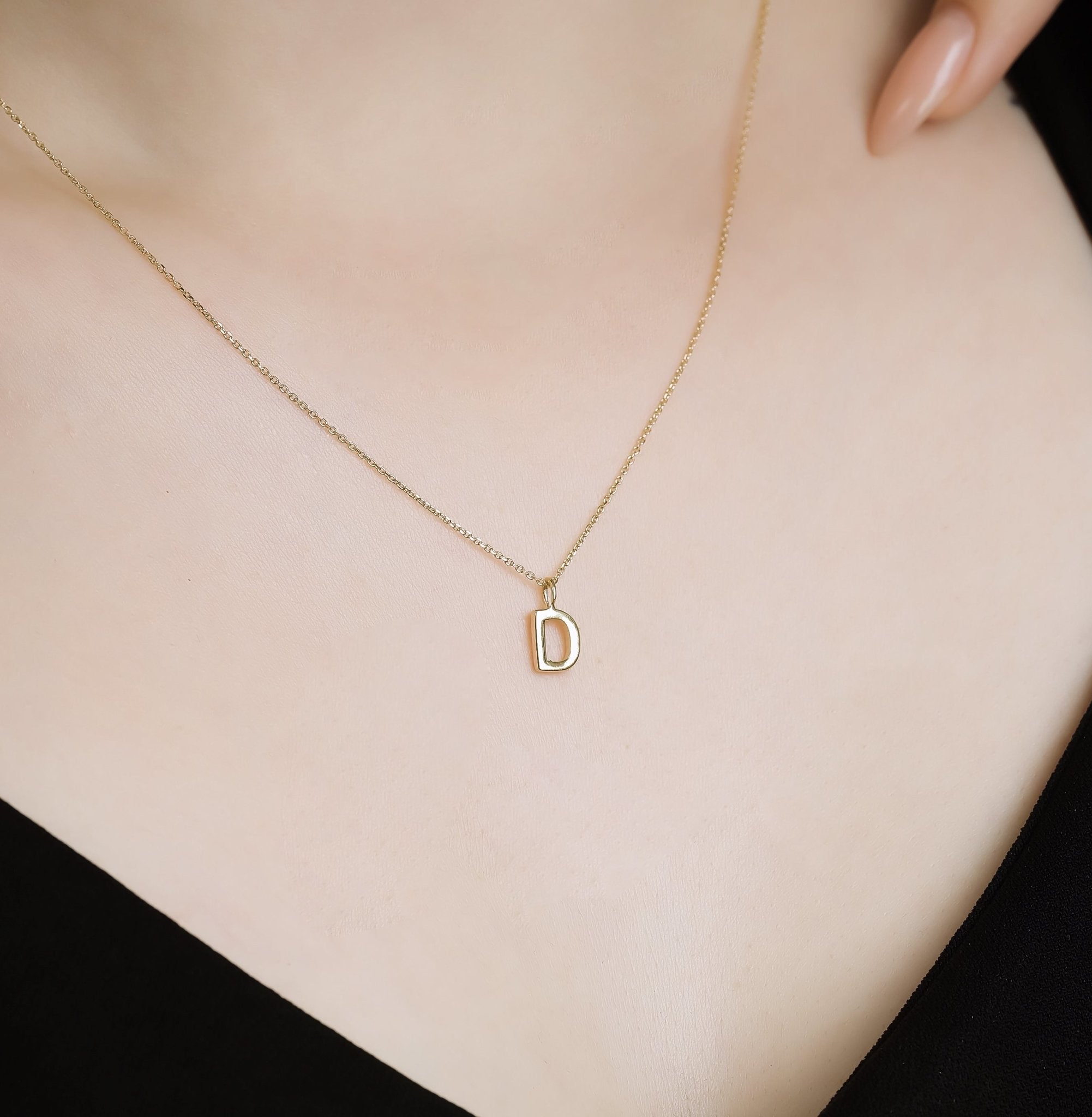 14K solid yellow gold initial necklace featuring the letter D, stylish and dainty, perfect for personalized gifting.