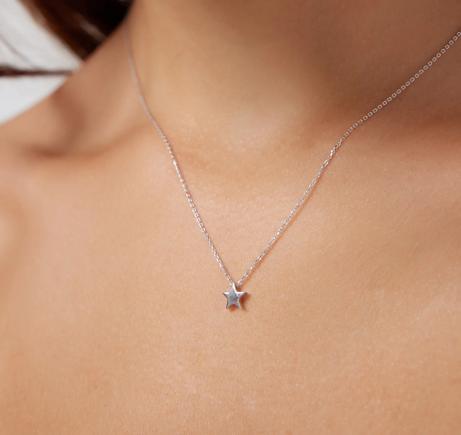 14K Solid Yellow Gold Minimalist Star Necklace on a woman, showcasing its delicate design and elegant style, perfect for everyday wear.