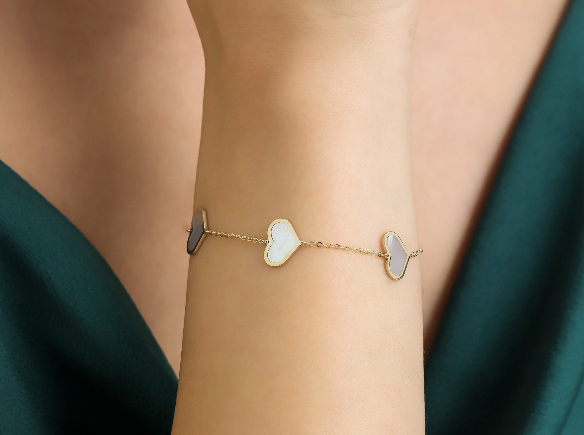 14K solid yellow gold bracelet with mother of pearl heart stations, elegant gift for any occasion.