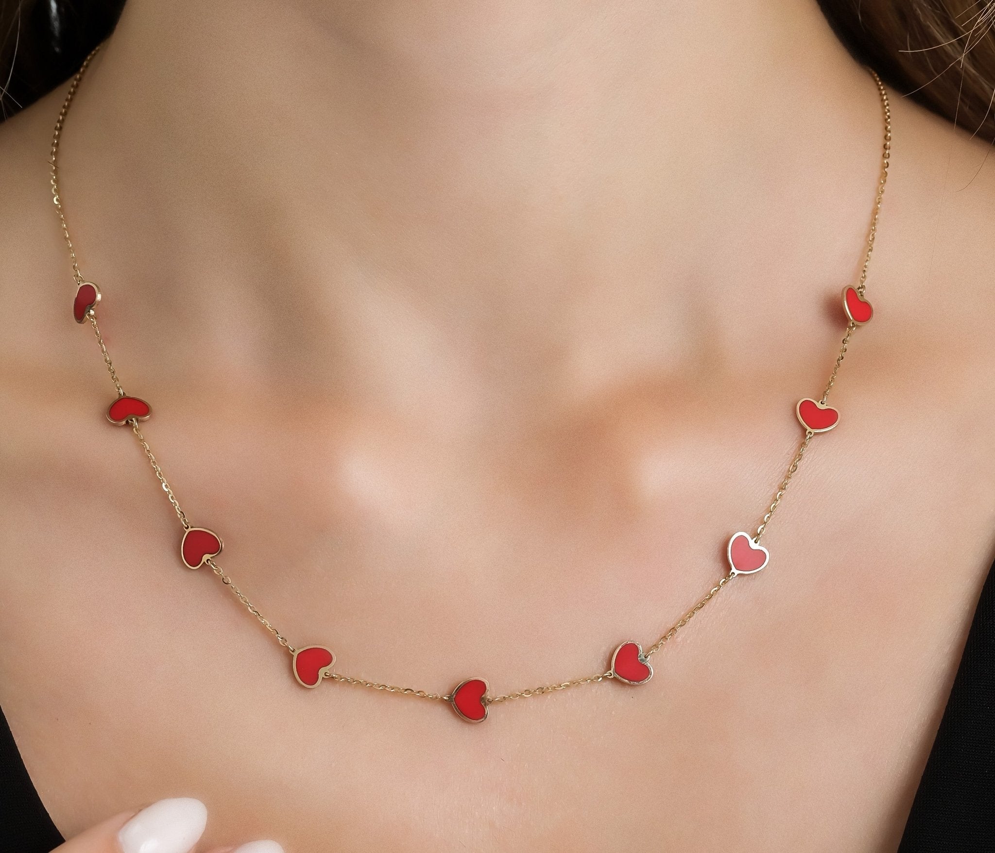 14K solid yellow gold necklace with red coral hearts, perfect for everyday wear and stylish gifts.