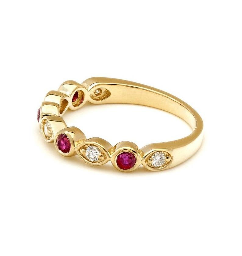14K yellow gold wedding ring featuring lab-created rubies and diamonds, showcasing a shiny finish and elegant design.