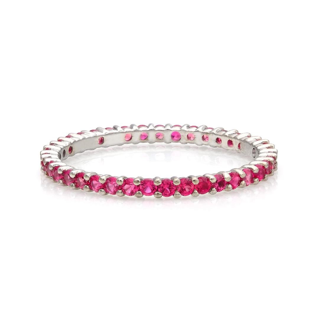 14K yellow gold full eternity ruby wedding band featuring 39 lab-created rubies in a prong setting.