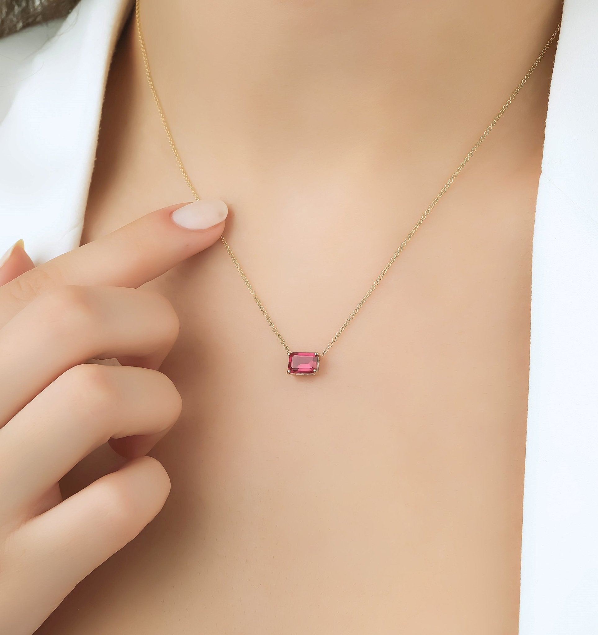 14K solid yellow gold ruby necklace on model, minimalist prong setting, July birthstone, 7x5mm pendant.
