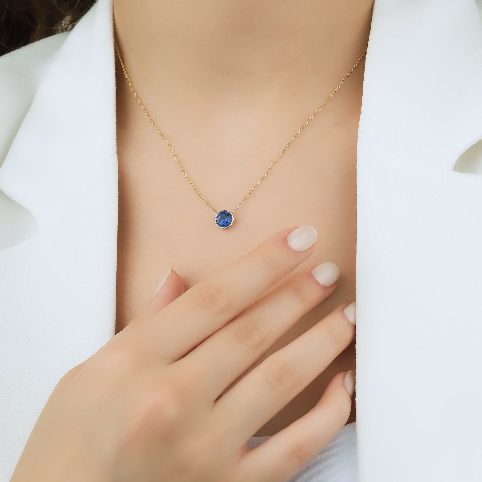 14K yellow gold necklace with a 6mm bezel set lab-created sapphire pendant, perfect for everyday elegance.