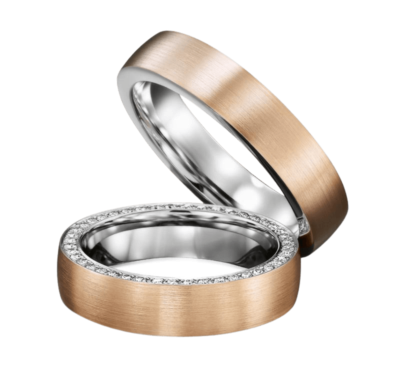 His and hers two-tone gold diamond wedding bands set with satin finish and brilliant round cut diamonds.