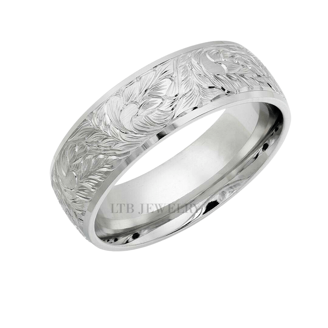 14K white gold hand engraved wedding band featuring leafy motifs, comfort fit design, and shiny finish.
