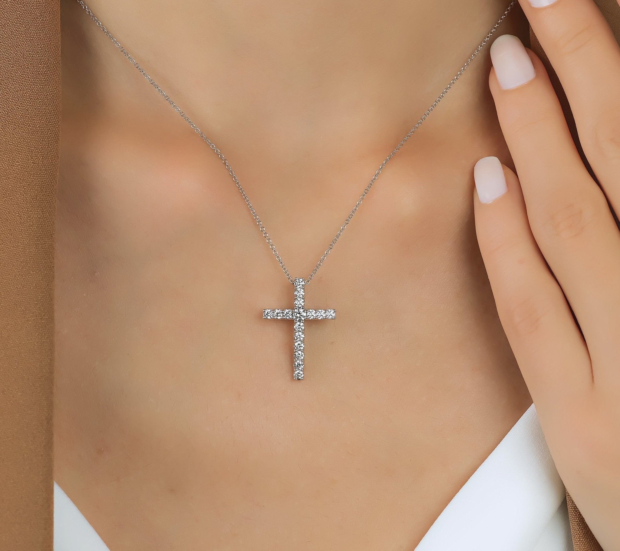 14K white gold lab created diamond cross necklace worn by model, showcasing 0.55 carats of sparkling diamonds.