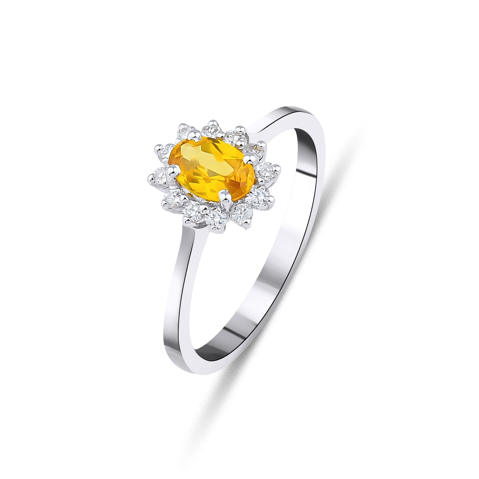 14K white gold citrine and diamond ring featuring an oval citrine and round diamond accents.