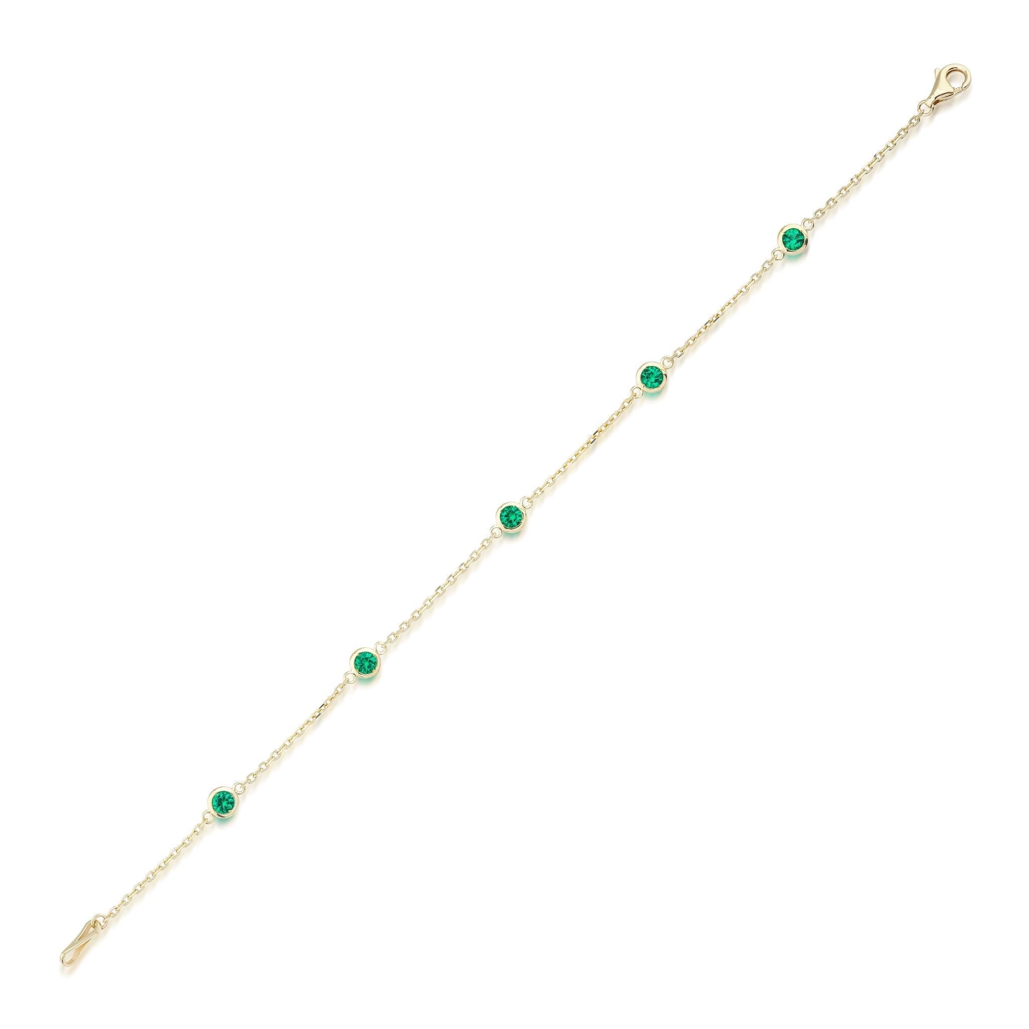 14K yellow gold dainty bracelet featuring 5 lab-created emeralds, minimalist design, perfect for everyday wear.