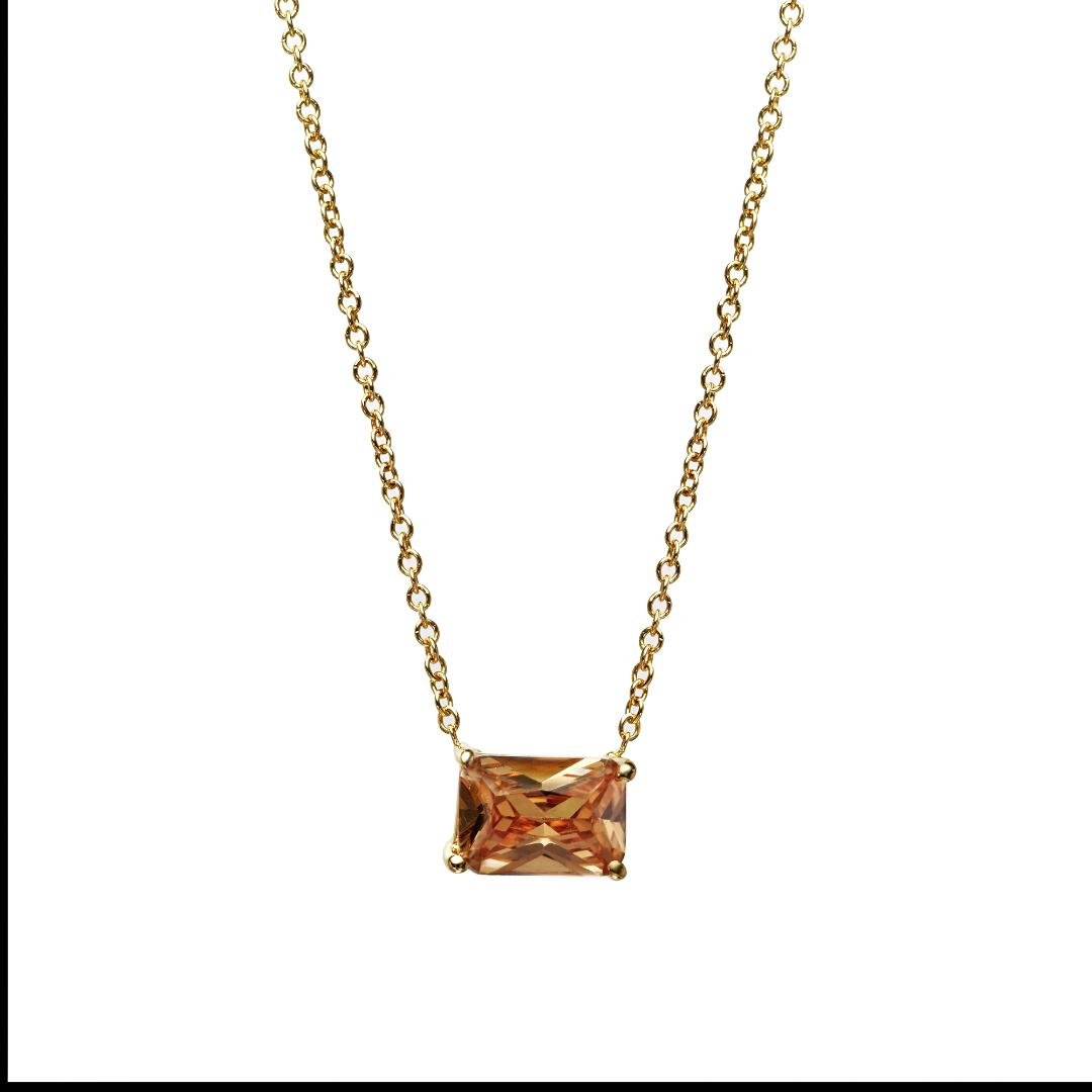 14K yellow gold emerald cut champagne color solitaire necklace with 7x5mm pendant, minimalist design, and 16-inch chain.
