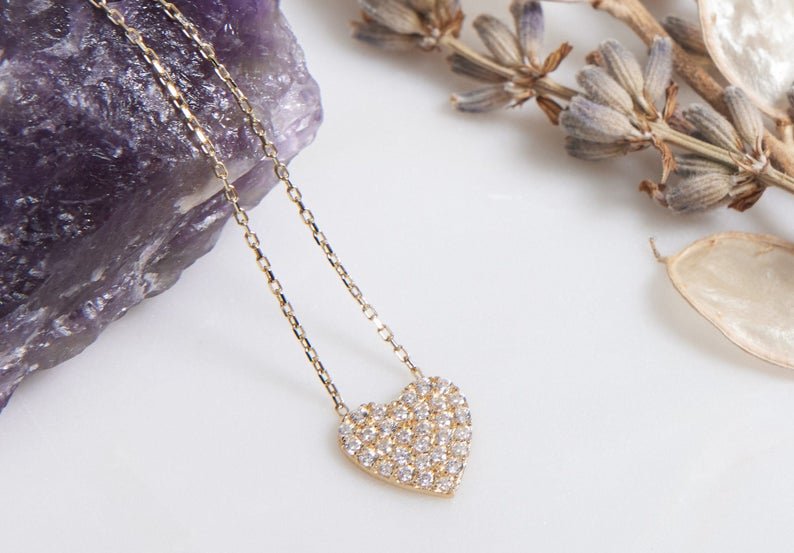 14K solid yellow gold dainty heart necklace with CZ on a purple stone background, perfect for everyday wear.