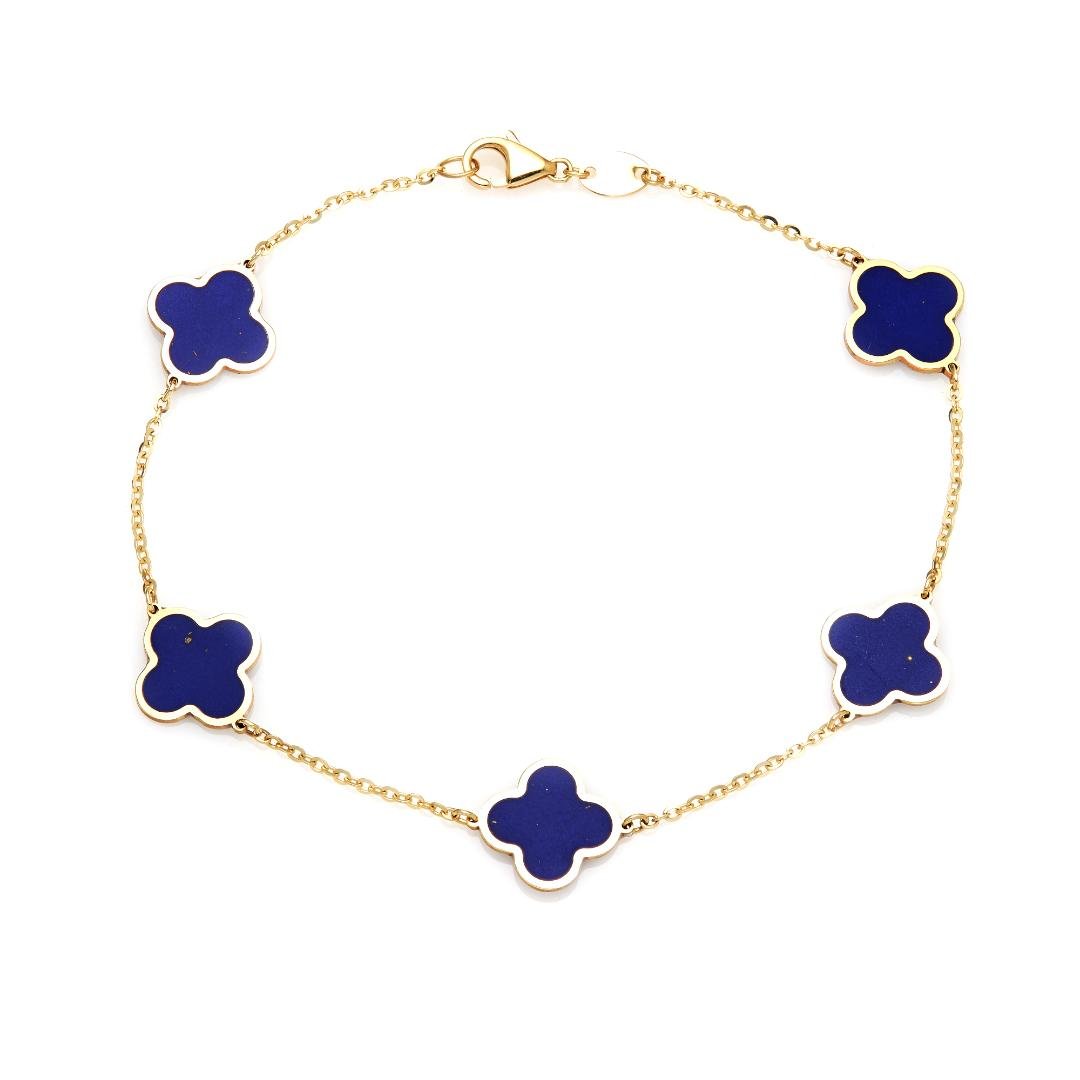 14K yellow gold lapis four leaf clover station bracelet, delicate and stylish, perfect for everyday wear.