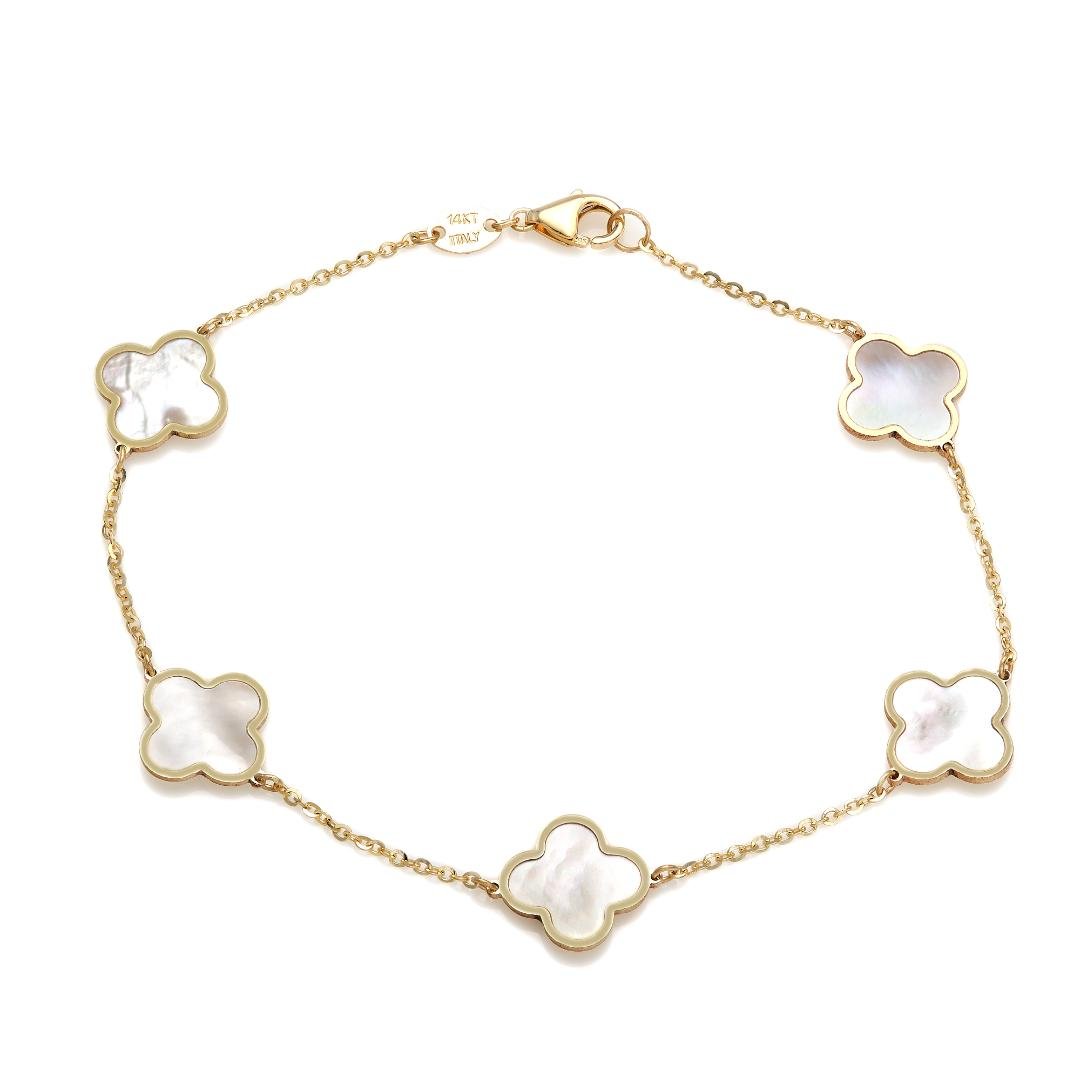 14K yellow gold bracelet with mother of pearl four leaf clovers, delicate design, 7 inches long, perfect for everyday wear.