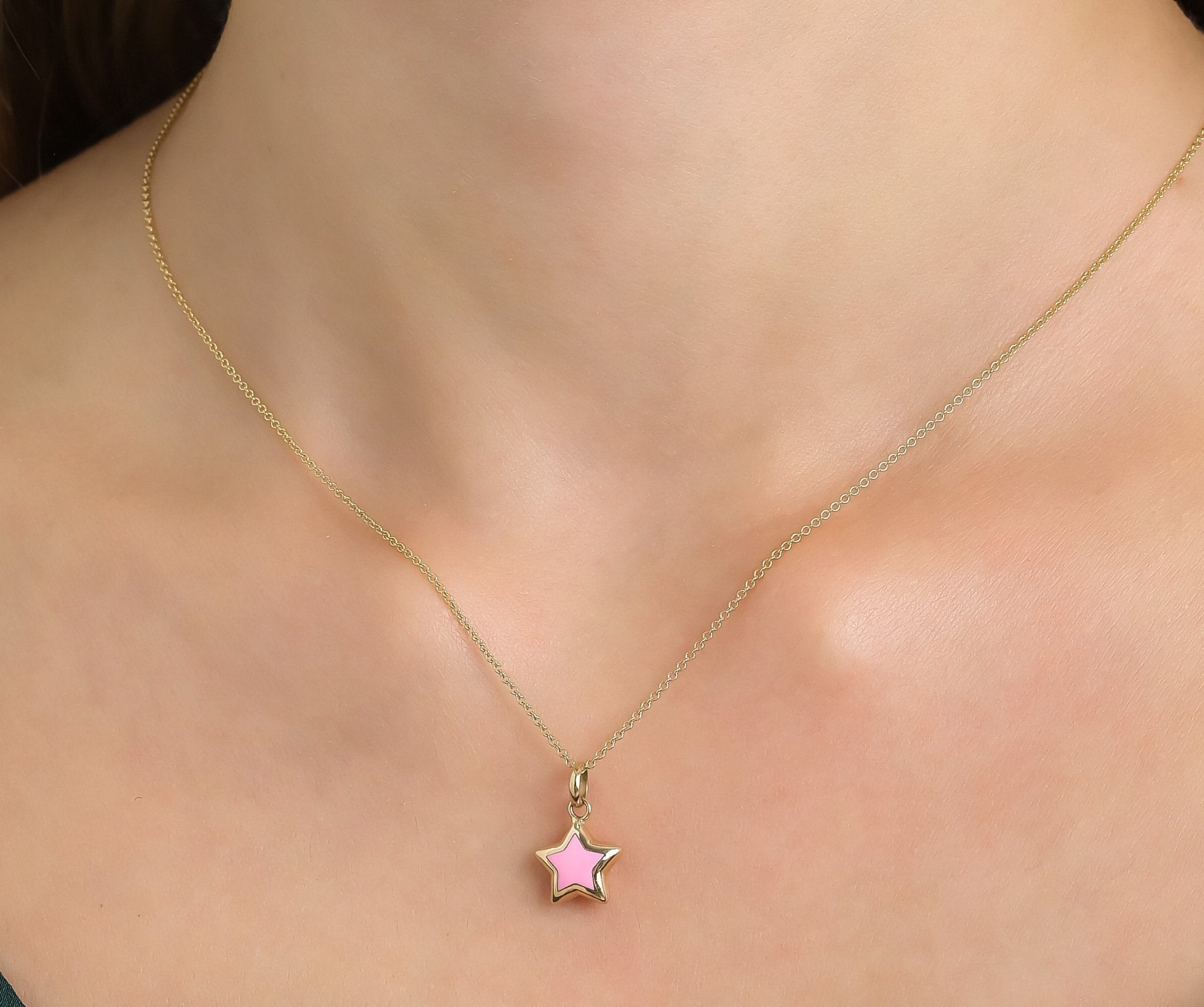 14K yellow gold necklace with pink star pendant, delicate and classy design perfect for everyday wear.
