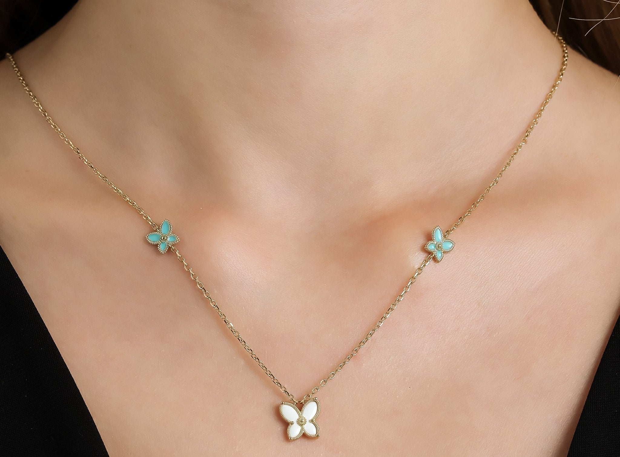 14K yellow gold enamel butterfly necklace featuring delicate turquoise flowers, perfect for everyday wear.