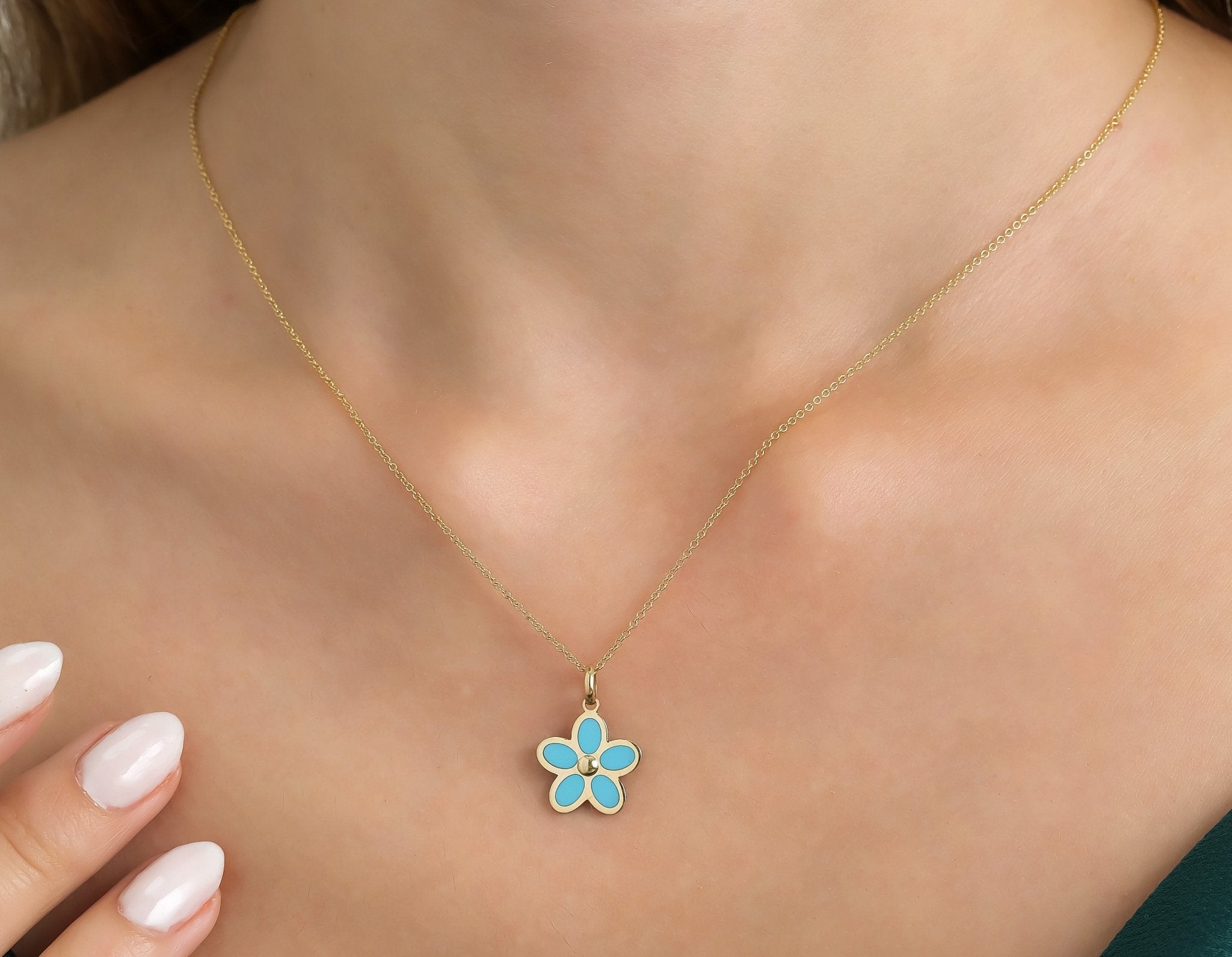 Dainty 14K yellow gold necklace featuring a turquoise daisy flower pendant, perfect for everyday wear.