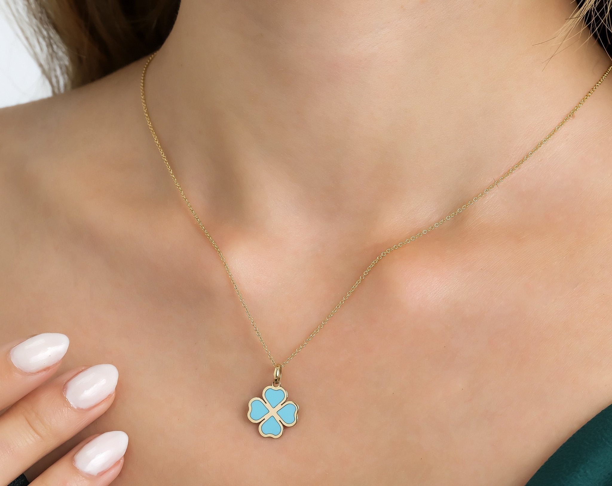 Dainty 14K yellow gold necklace featuring turquoise four leaf clover pendant, perfect for everyday wear.