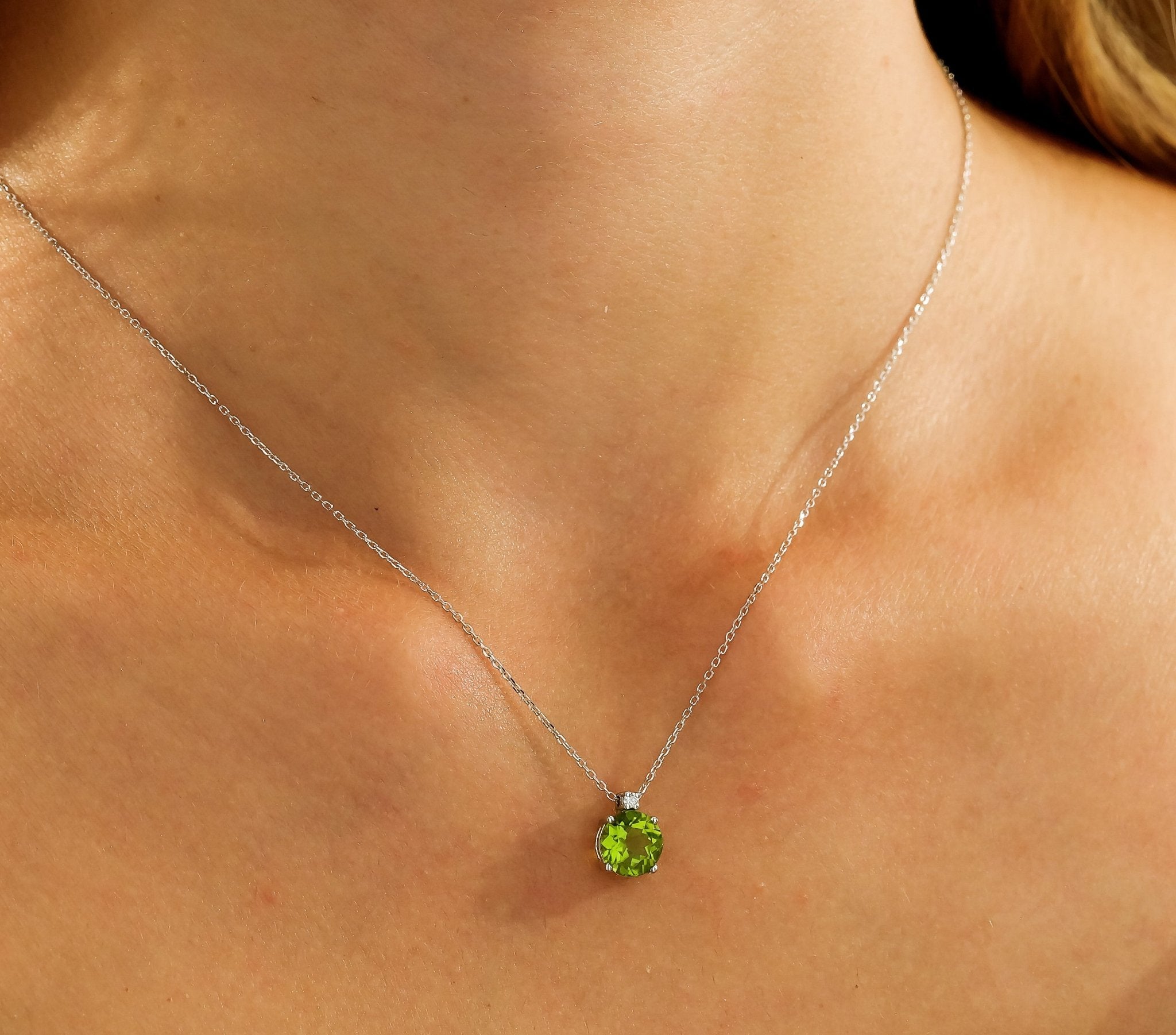14K solid white gold necklace showcasing a natural peridot pendant and diamond, perfect for everyday elegance.