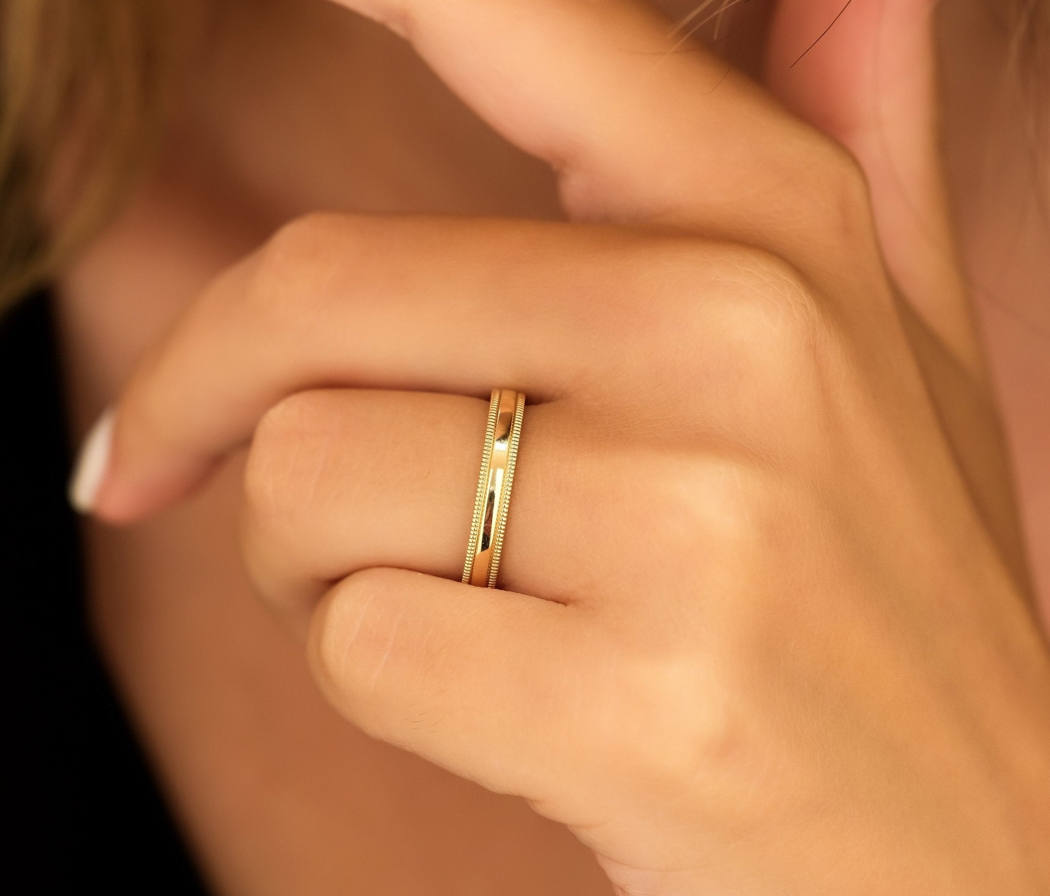Unisex 3mm 10K 14K 18K Yellow Gold Dome Milgrain Wedding Band worn on a hand with a shiny finish.