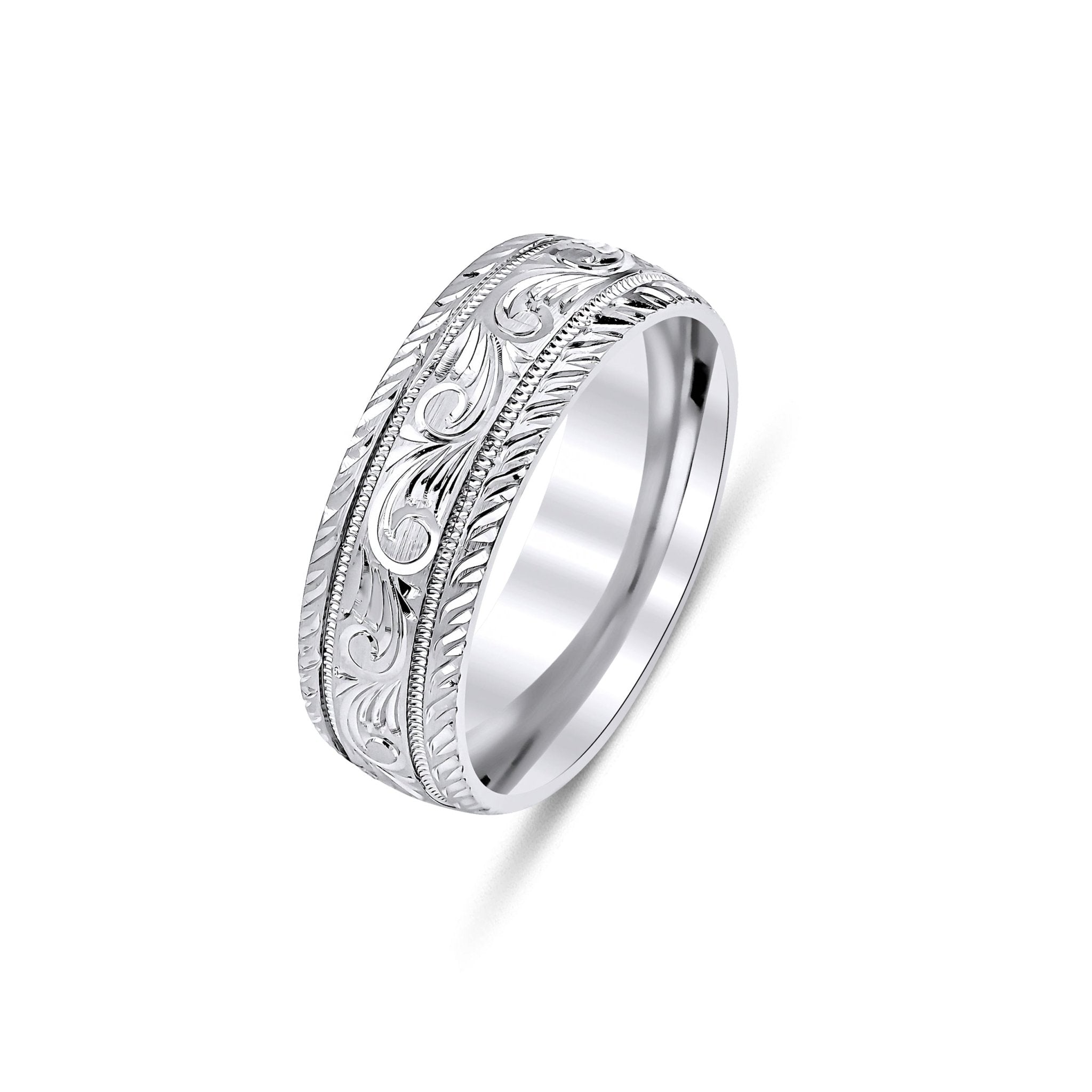Hand engraved 7mm white gold wedding ring featuring shiny leaf motifs and milgrain detailing, comfort fit design.