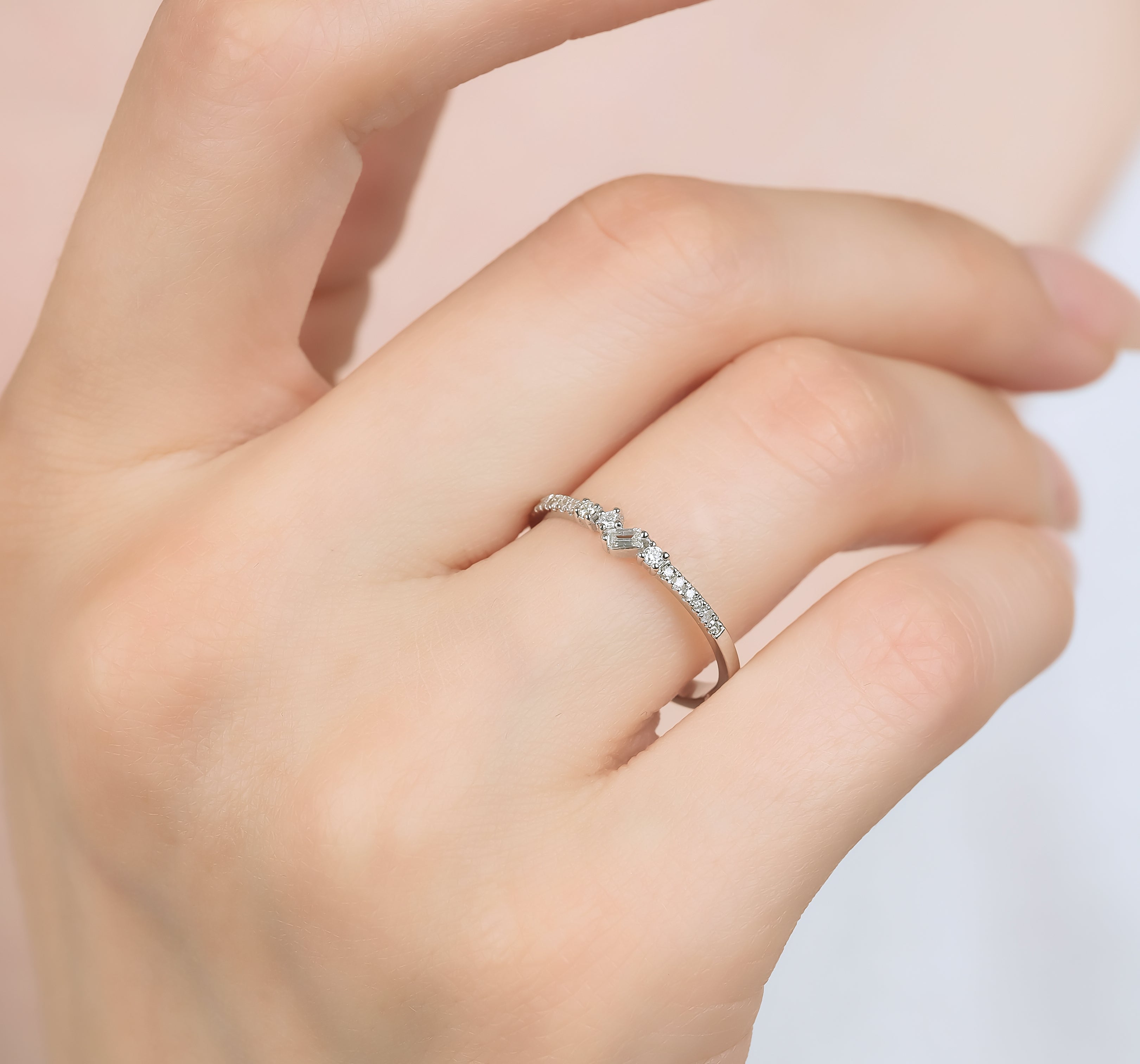 Elegant 14K white gold minimalist baguette diamond wedding ring with 29 round diamonds, showcasing timeless sophistication.